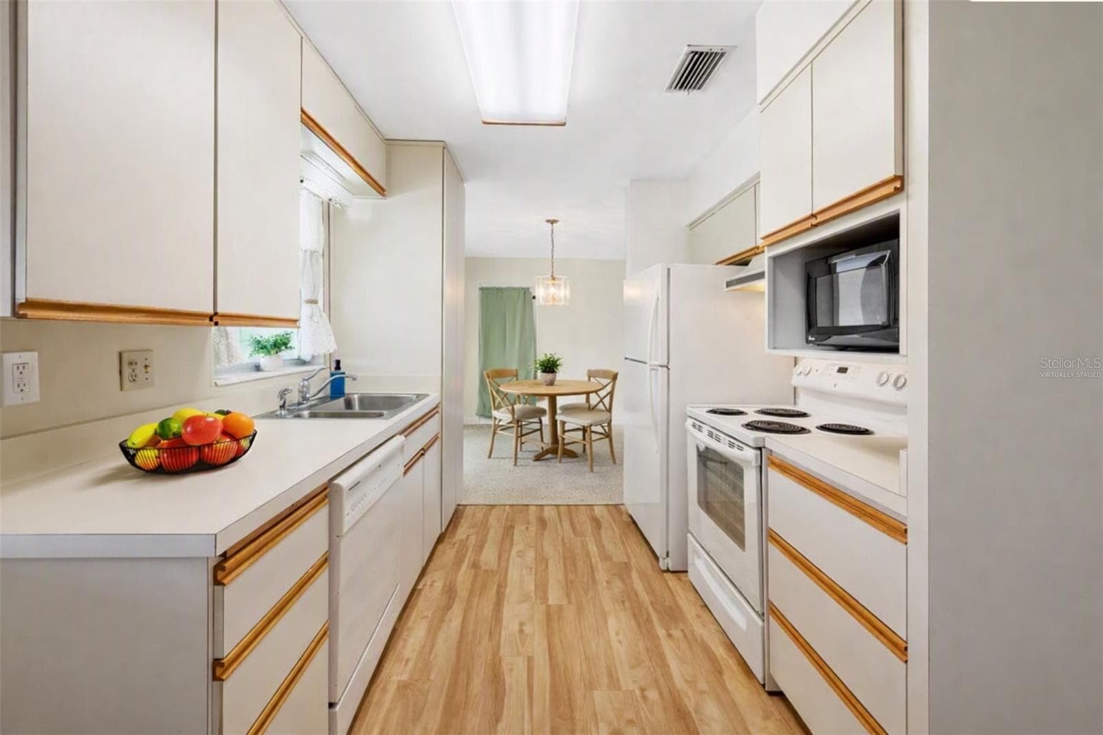 Virtually Staged - Functional, Light and Bright Kitchen with plenty of cabinet and drawer space. - 11450 80TH AVE, SEMINOLE