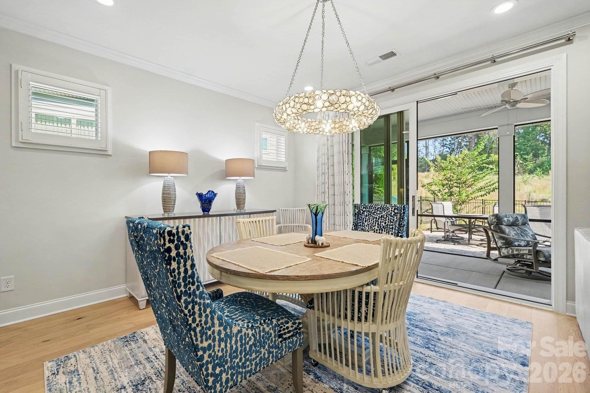 Dining room opens to covered patio with custom sliders - 5605 Caneel Lane, Denver