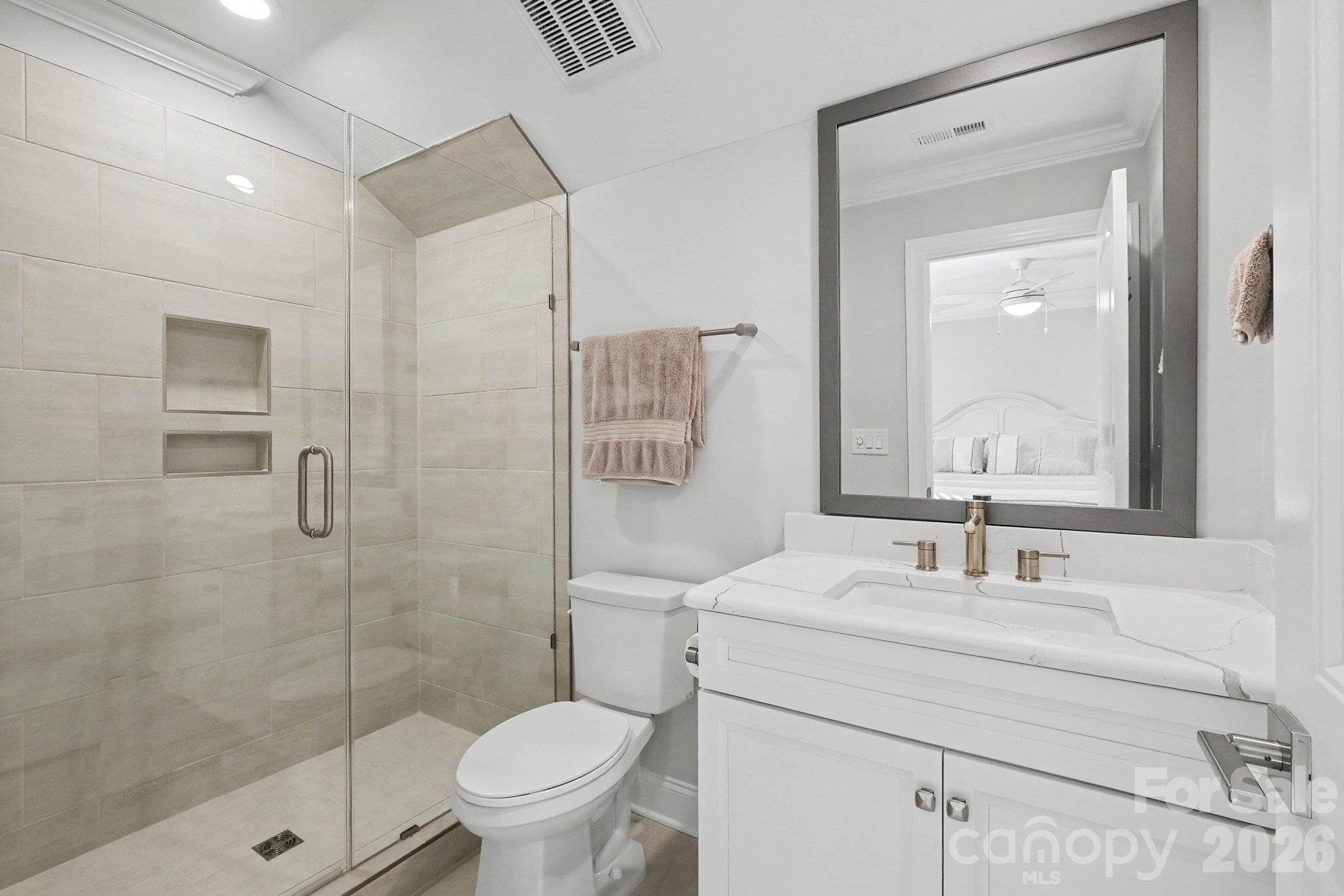 Secondary Primary Suite offers quartz and tiled built-ins - 5605 Caneel Lane, Denver