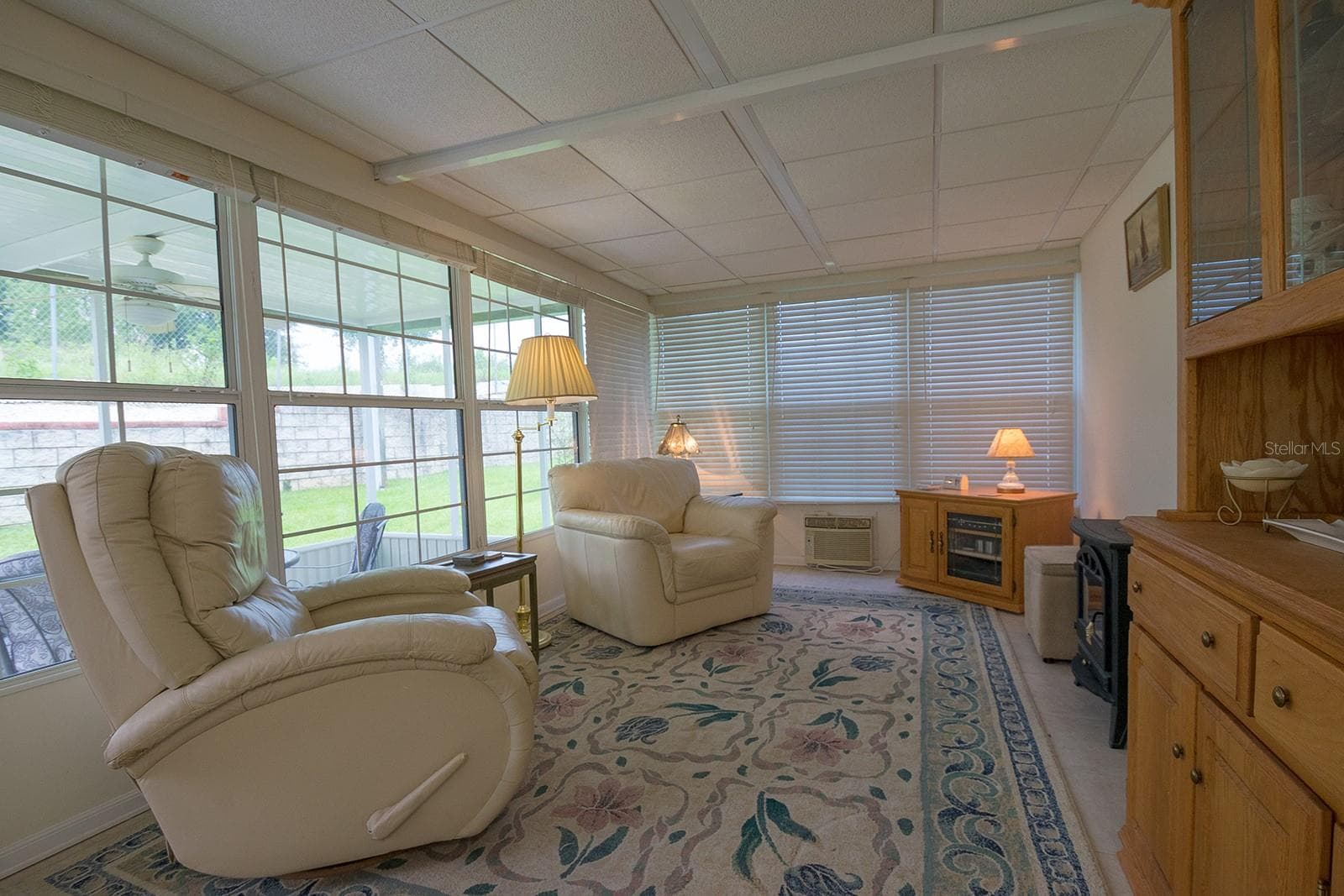 Enclosed Bonus/Florida room with ceramic tile floors, double pane windows and wall AC! - 37449 GILL AVE, ZEPHYRHILLS