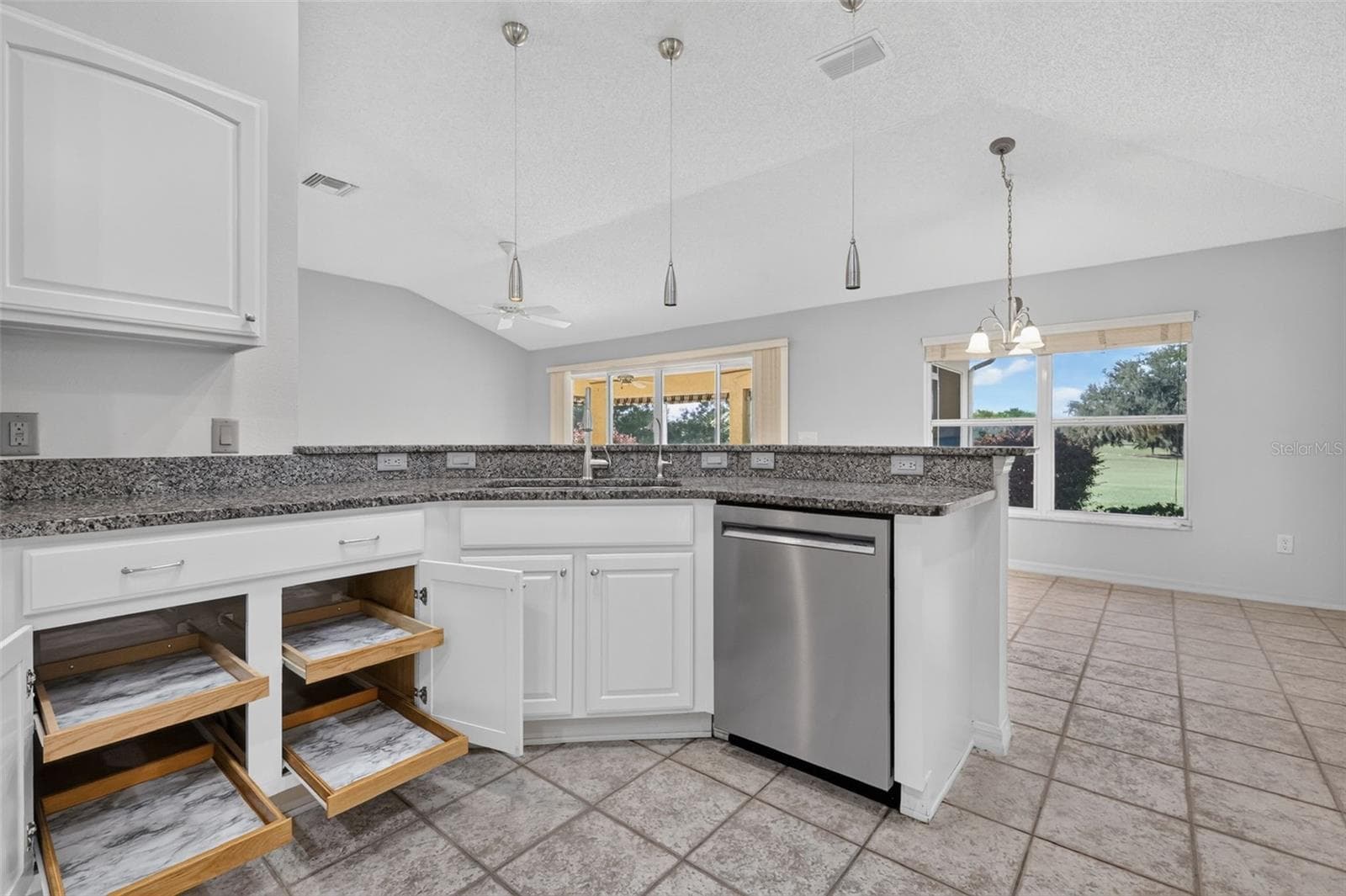 Kitchen with Roll-Out Shelving - 16840 SE 85TH SAPELO CT, THE VILLAGES