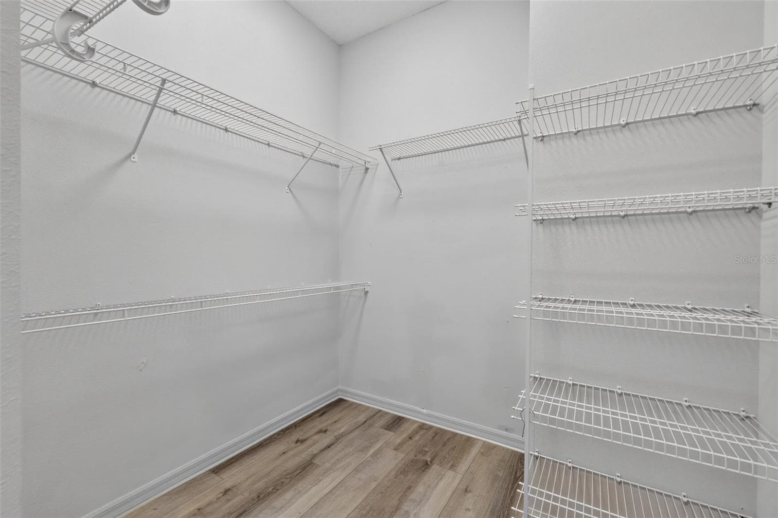 Primary Bedroom Walk-In Closet - 16840 SE 85TH SAPELO CT, THE VILLAGES