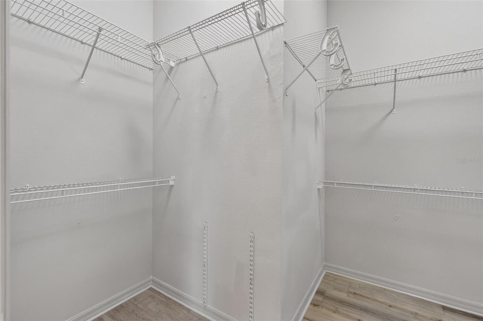 Primary Bedroom Walk-In Closet - 16840 SE 85TH SAPELO CT, THE VILLAGES
