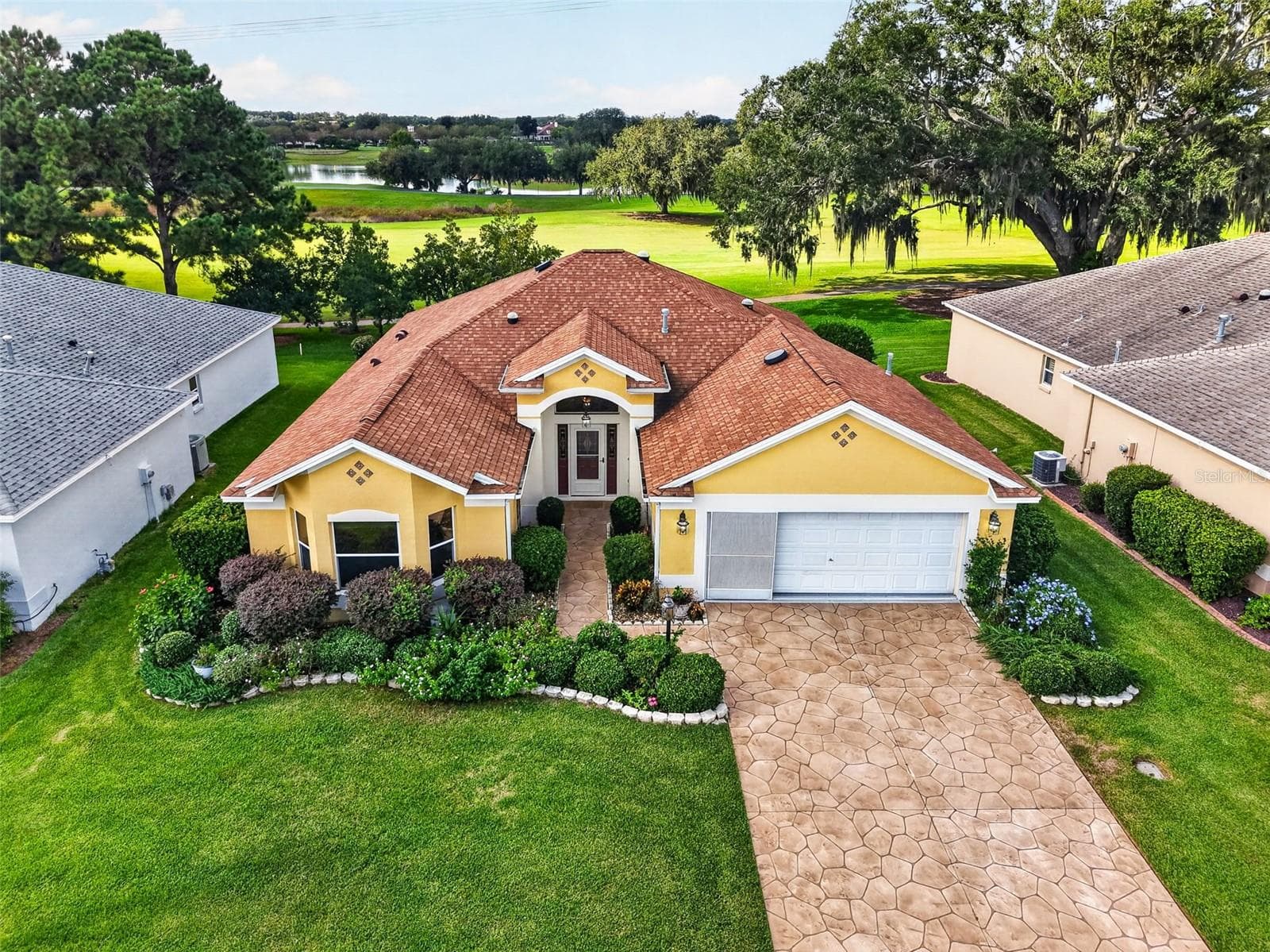 Aerial Front Elevation with GOLF and WATER VIEWS! - 16840 SE 85TH SAPELO CT, THE VILLAGES