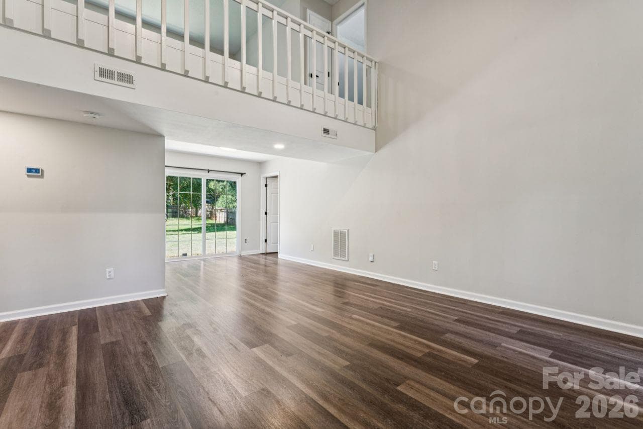 Living room into dining - 6719 Montezuma Trail, Charlotte