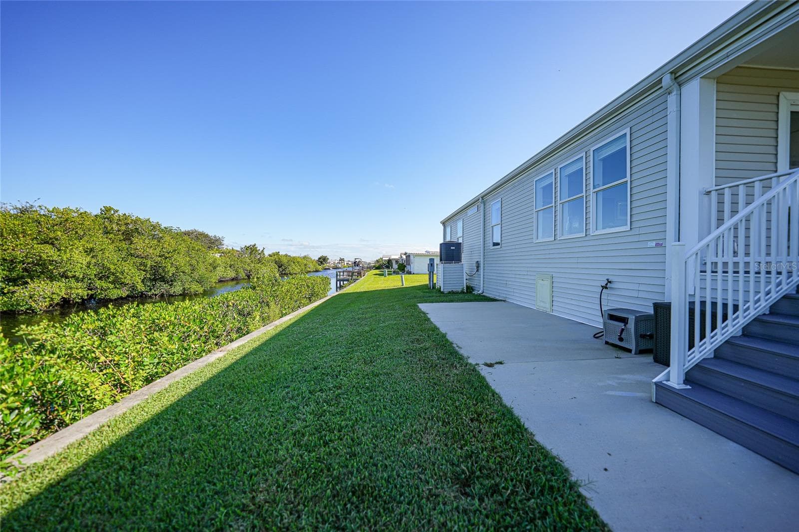 Back of home on Canal - 734 BLACKBURN BLVD, NORTH PORT