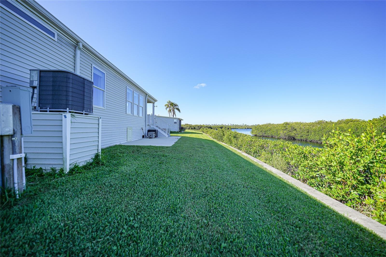 Back of home on Canal - 734 BLACKBURN BLVD, NORTH PORT