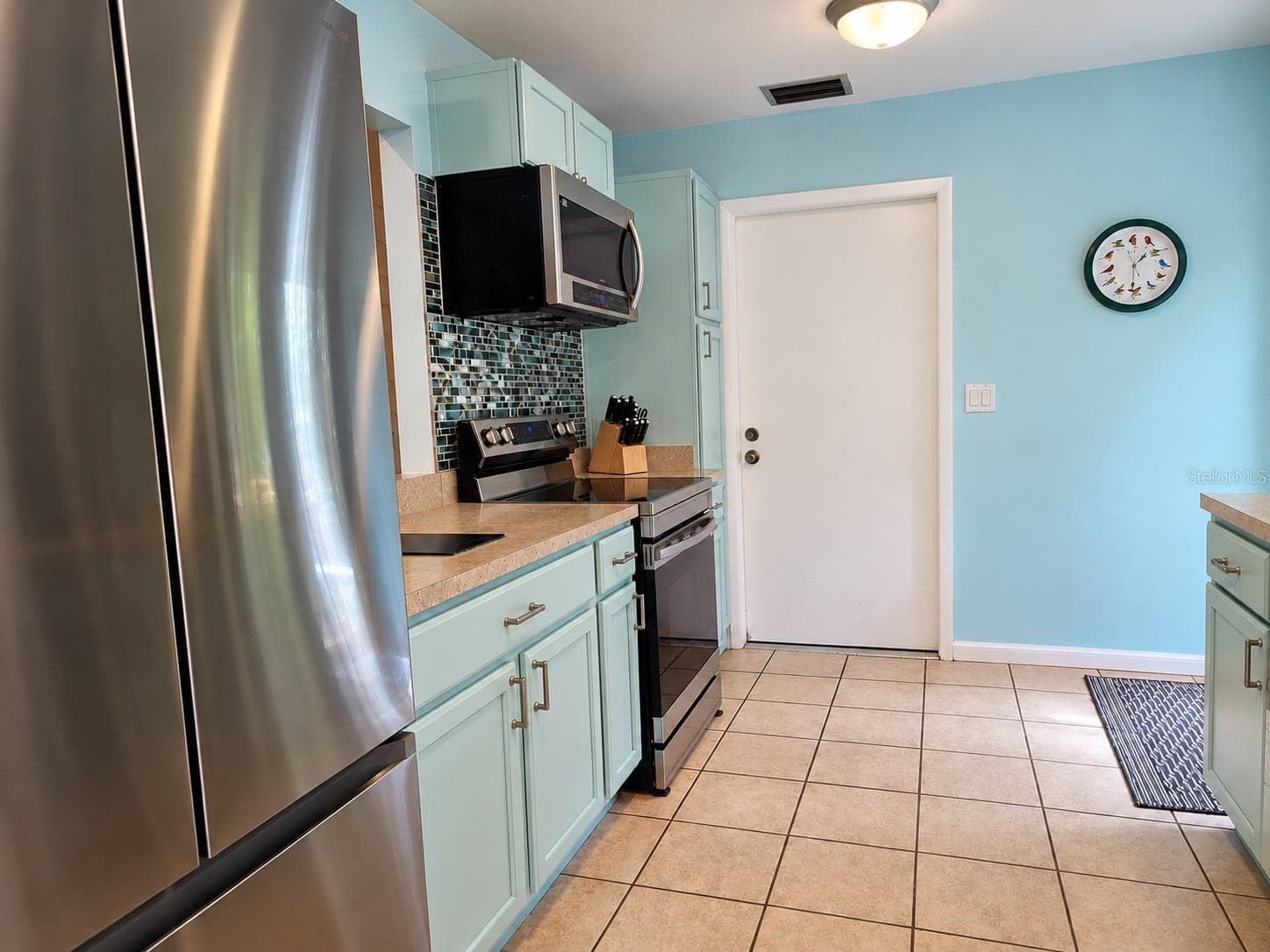 entry to garage from kitchen for easy unloading - 2310 QUAIL CT, BRADENTON