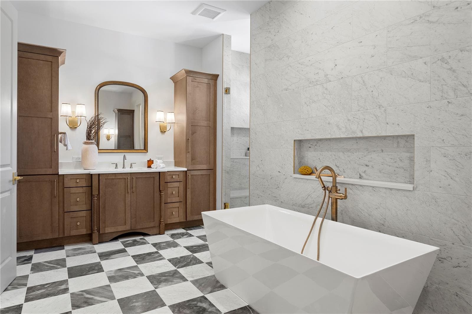 Primary bath with marble floors, soaking tub and large walk in shower - 5008 W DICKENS AVE, TAMPA