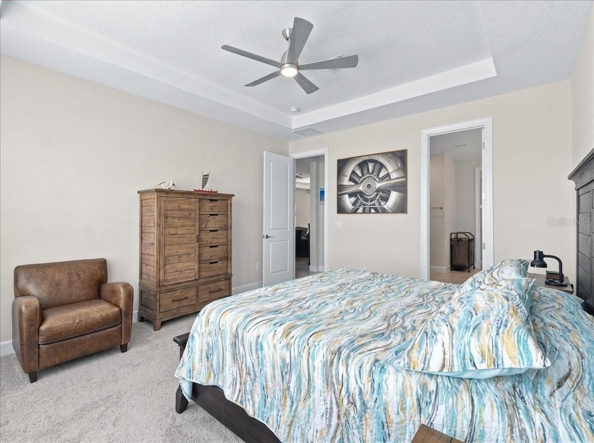 The Owner's suite has shutters and shades as well. There is a view of the pond from the bedroom. - 4732 CRESTPOINT WAY, PALMETTO