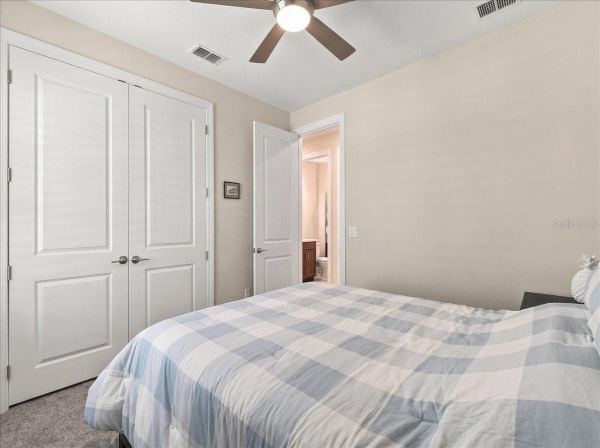 This bedroom also has privacy shades as well as shutters. - 4732 CRESTPOINT WAY, PALMETTO