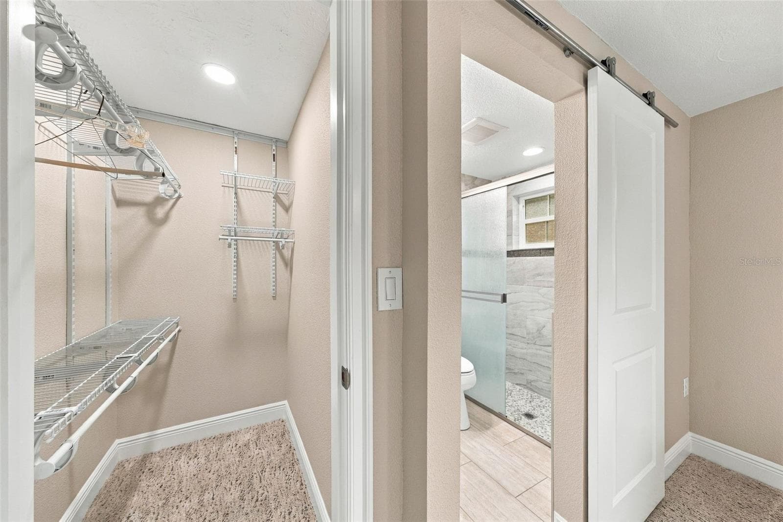 Primary bedroom walk in closet - 4219 STRATFORD DR #4219, NEW PORT RICHEY