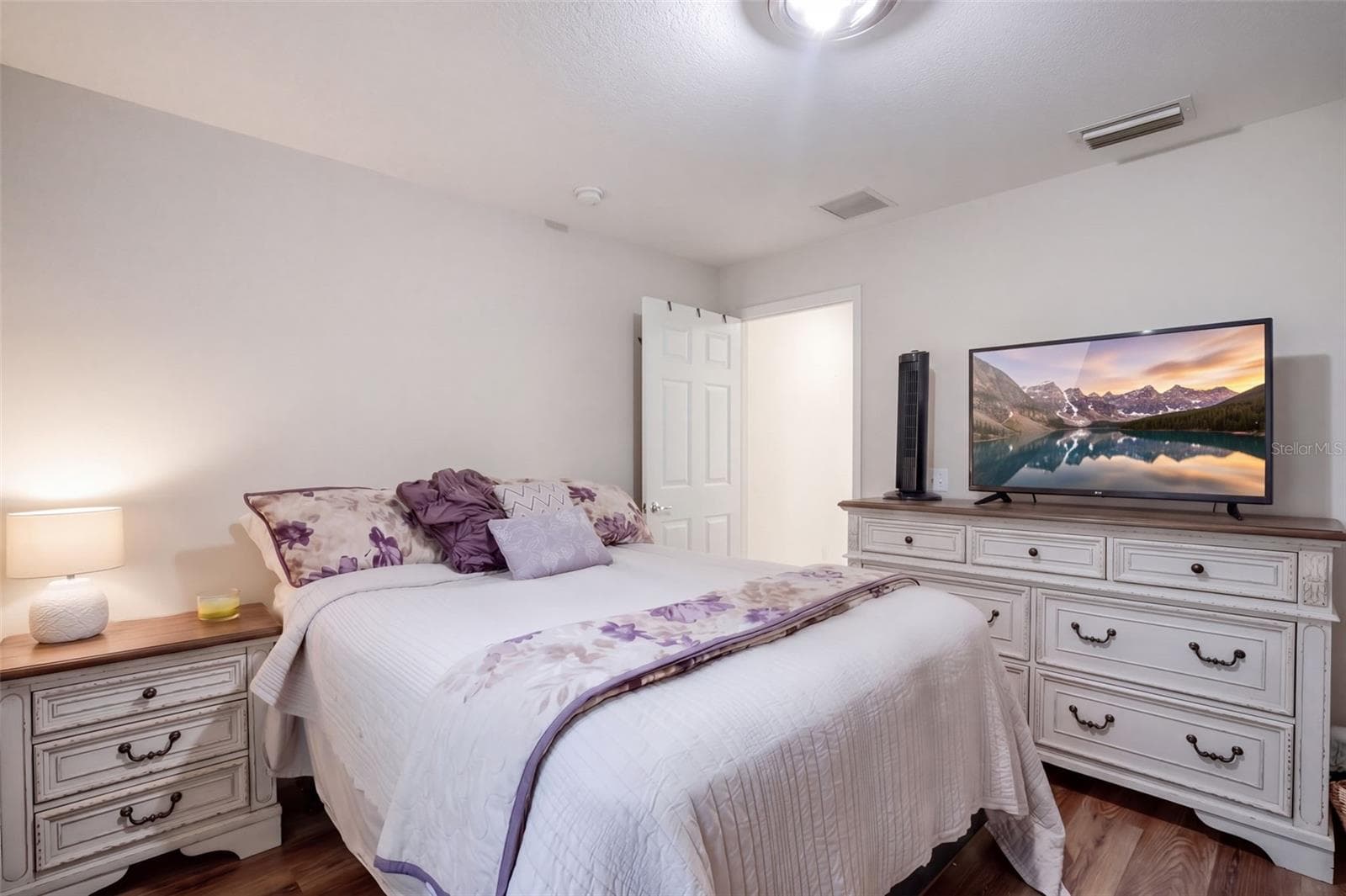 The primary bedroom offers a comfortable retreat with space for substantial furniture. - 71 ORANGE BLOSSOM DR, EUSTIS