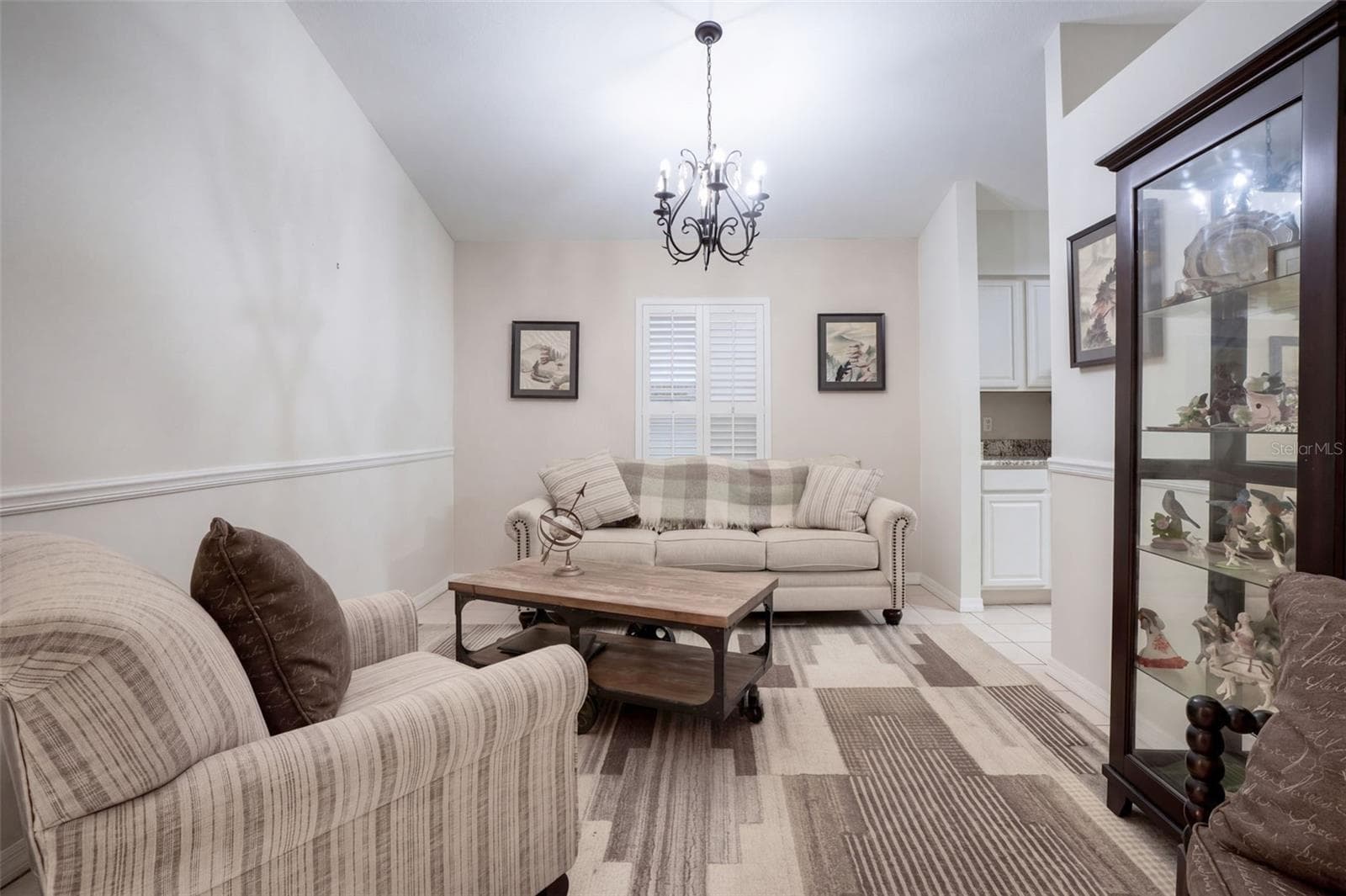 The front flex space works equally well as a sitting room, formal dining room, or conversation area. - 71 ORANGE BLOSSOM DR, EUSTIS
