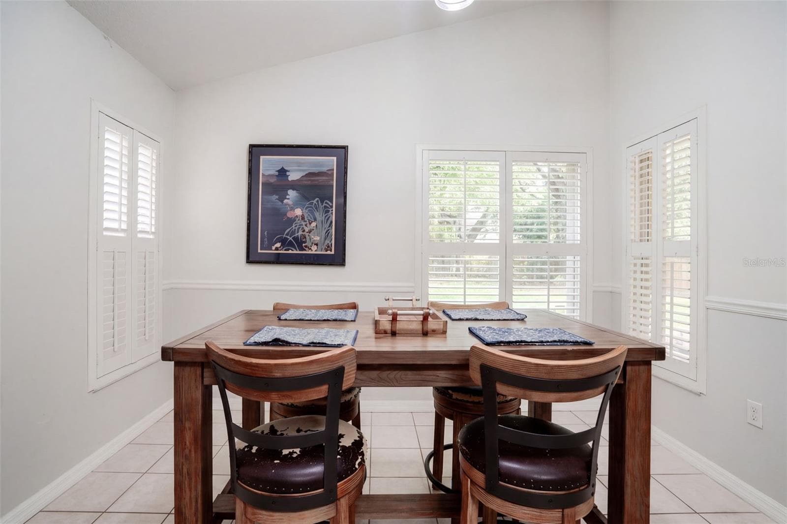 The sunny breakfast area offers a pleasant place for casual meals. - 71 ORANGE BLOSSOM DR, EUSTIS
