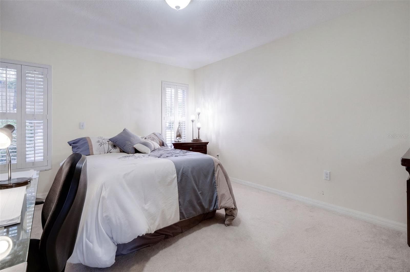The second bedroom is bright, comfortable, and ready for family or guests. - 71 ORANGE BLOSSOM DR, EUSTIS