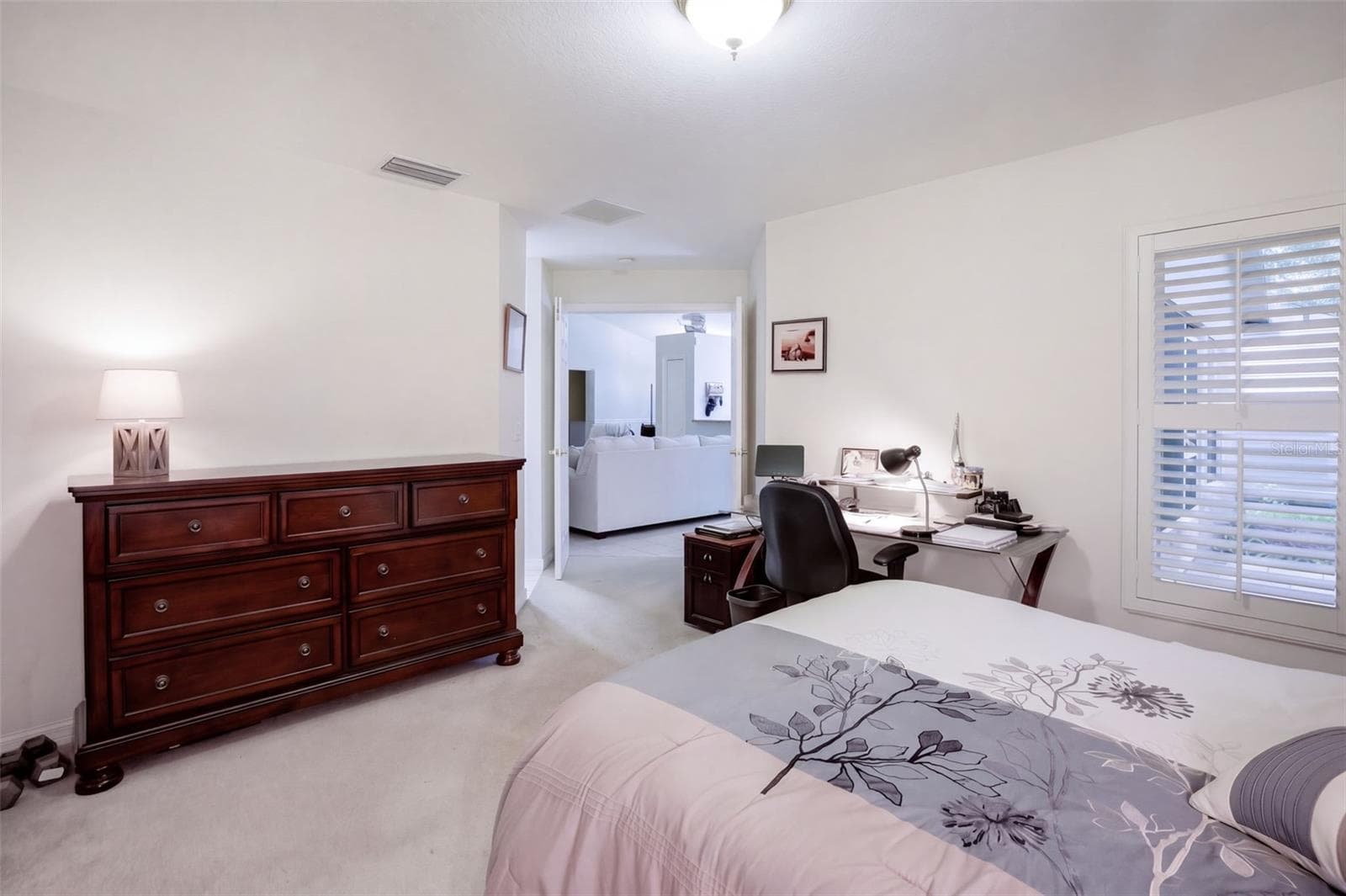 The guest bedroom offers convenient access to the hall and secondary bath. - 71 ORANGE BLOSSOM DR, EUSTIS