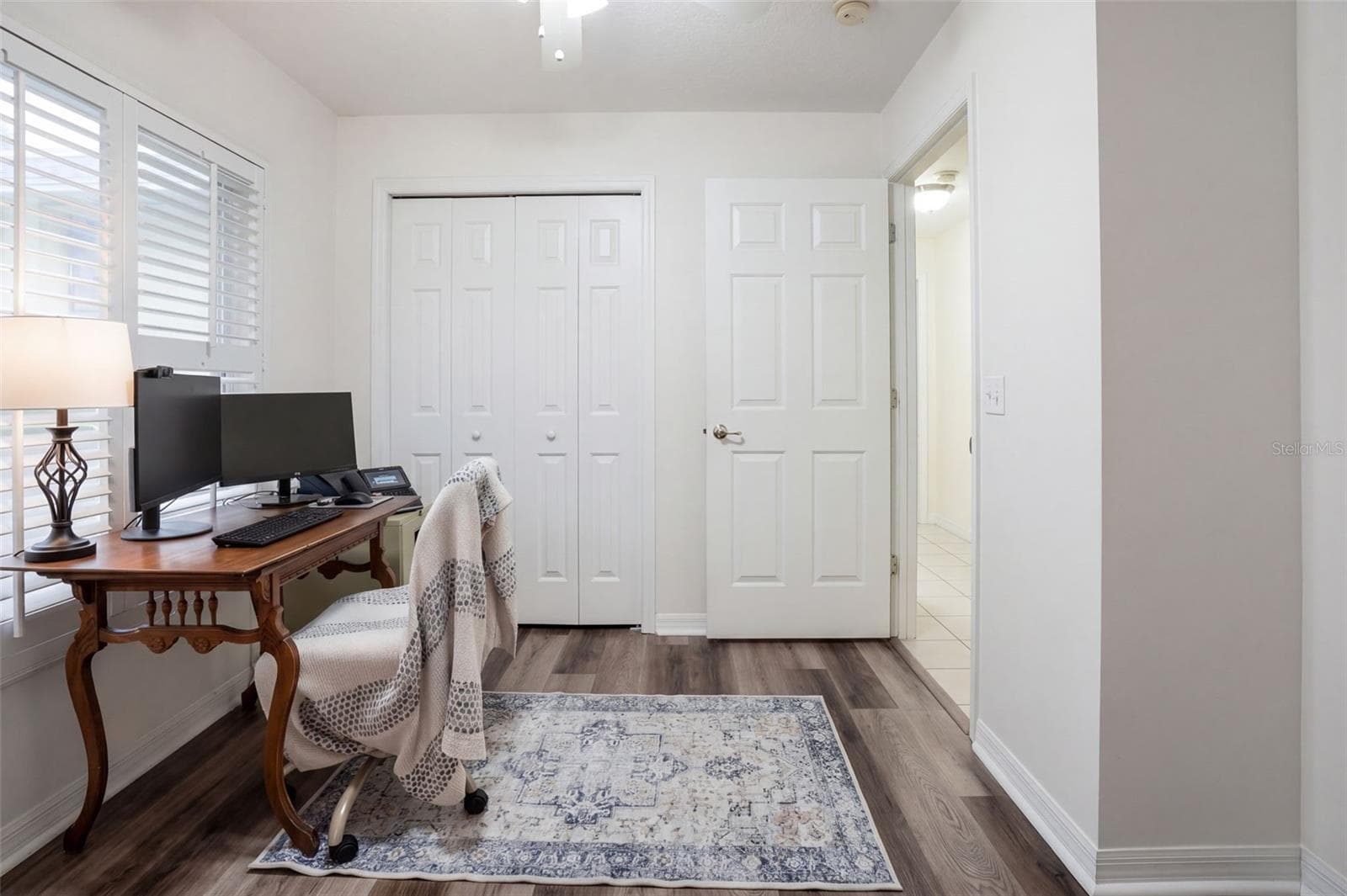 Another view shows the flexibility of the third bedroom for work, guests, or hobbies. - 71 ORANGE BLOSSOM DR, EUSTIS