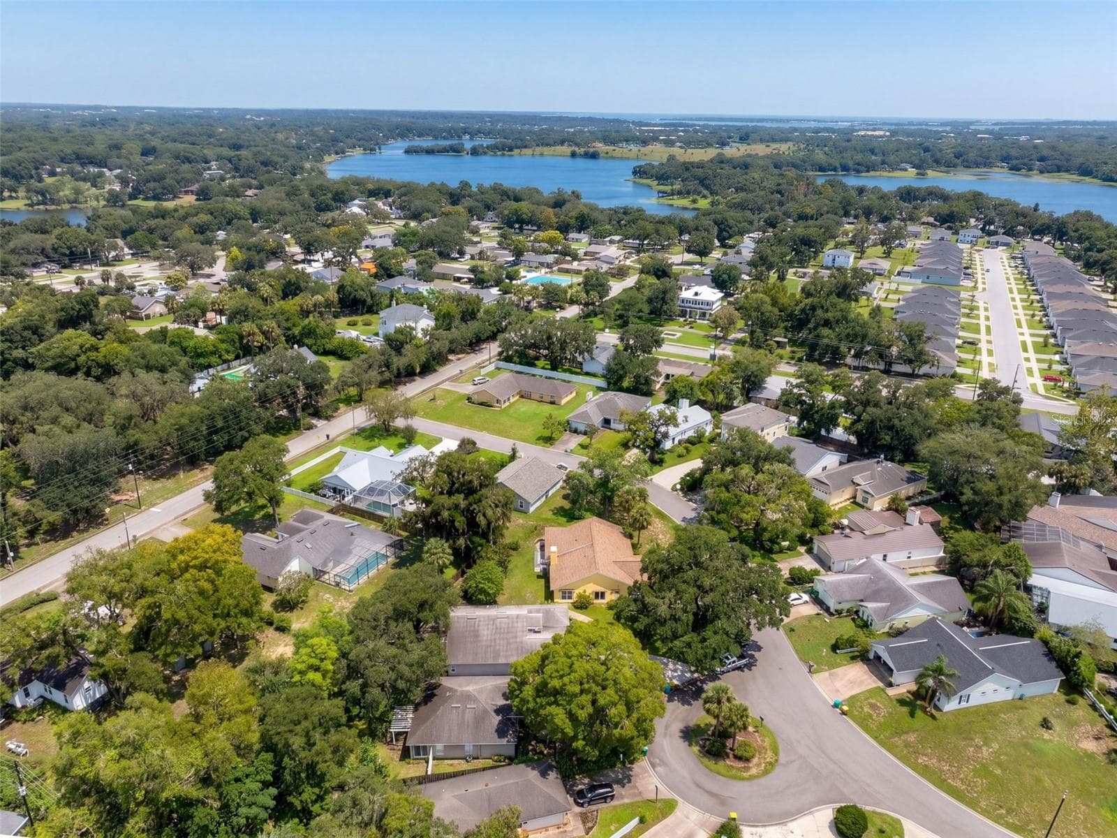 The neighborhood aerial shows nearby lakes and the established Eustis setting. - 71 ORANGE BLOSSOM DR, EUSTIS