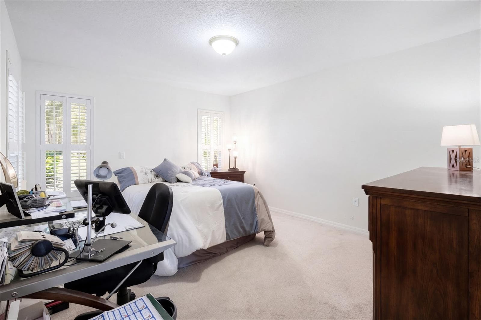 An additional view of the second bedroom shows its proportions and closet access. - 71 ORANGE BLOSSOM DR, EUSTIS