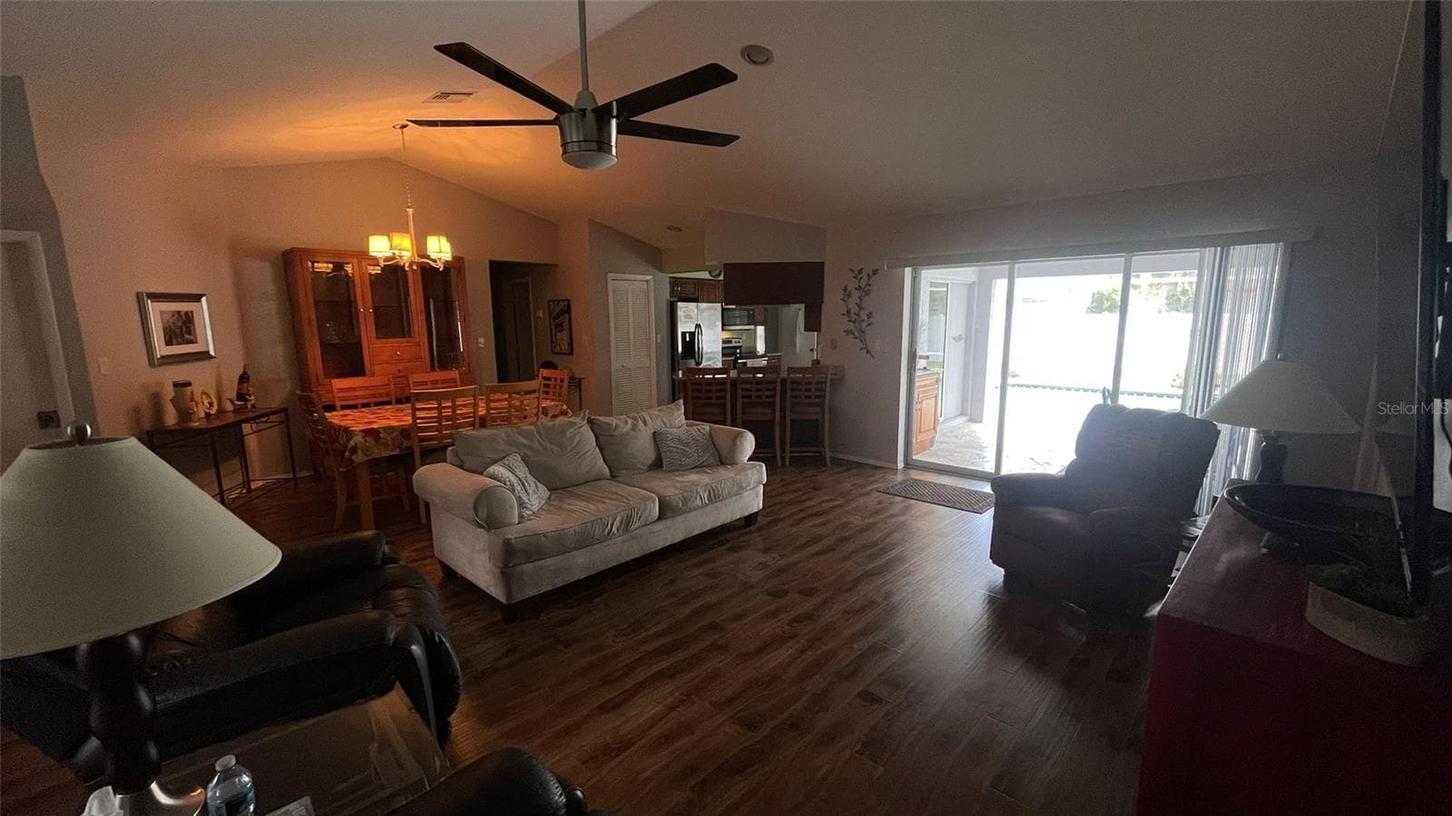 Living room with access to the lanai and pool. - 1009 LABELLE TER NW, PORT CHARLOTTE