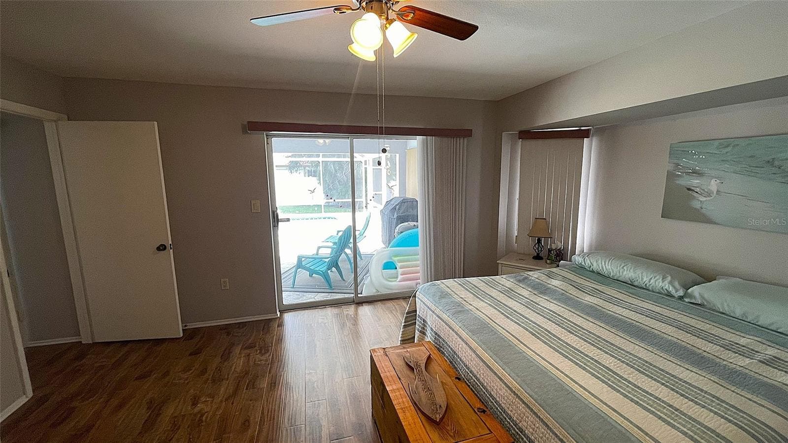 Primary bedroom w/ access to lanai & pool. - 1009 LABELLE TER NW, PORT CHARLOTTE