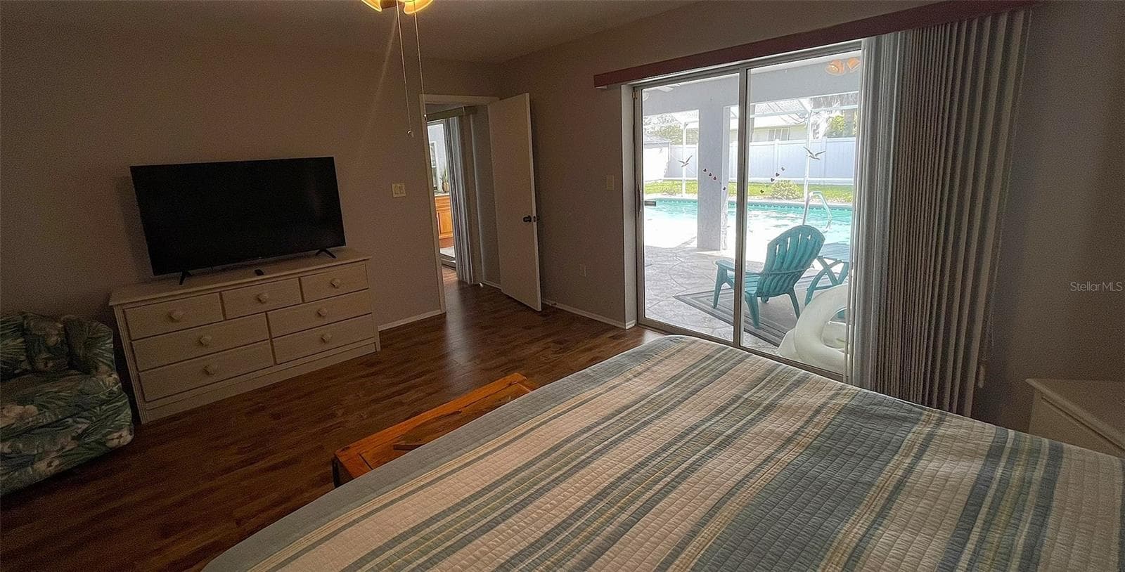 Primary bedroom w/ access to lanai & pool. - 1009 LABELLE TER NW, PORT CHARLOTTE