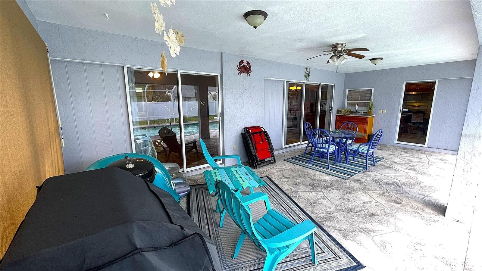 Slider access to Lanai from Primary Bedroom, Living room & Kitchen. - 1009 LABELLE TER NW, PORT CHARLOTTE