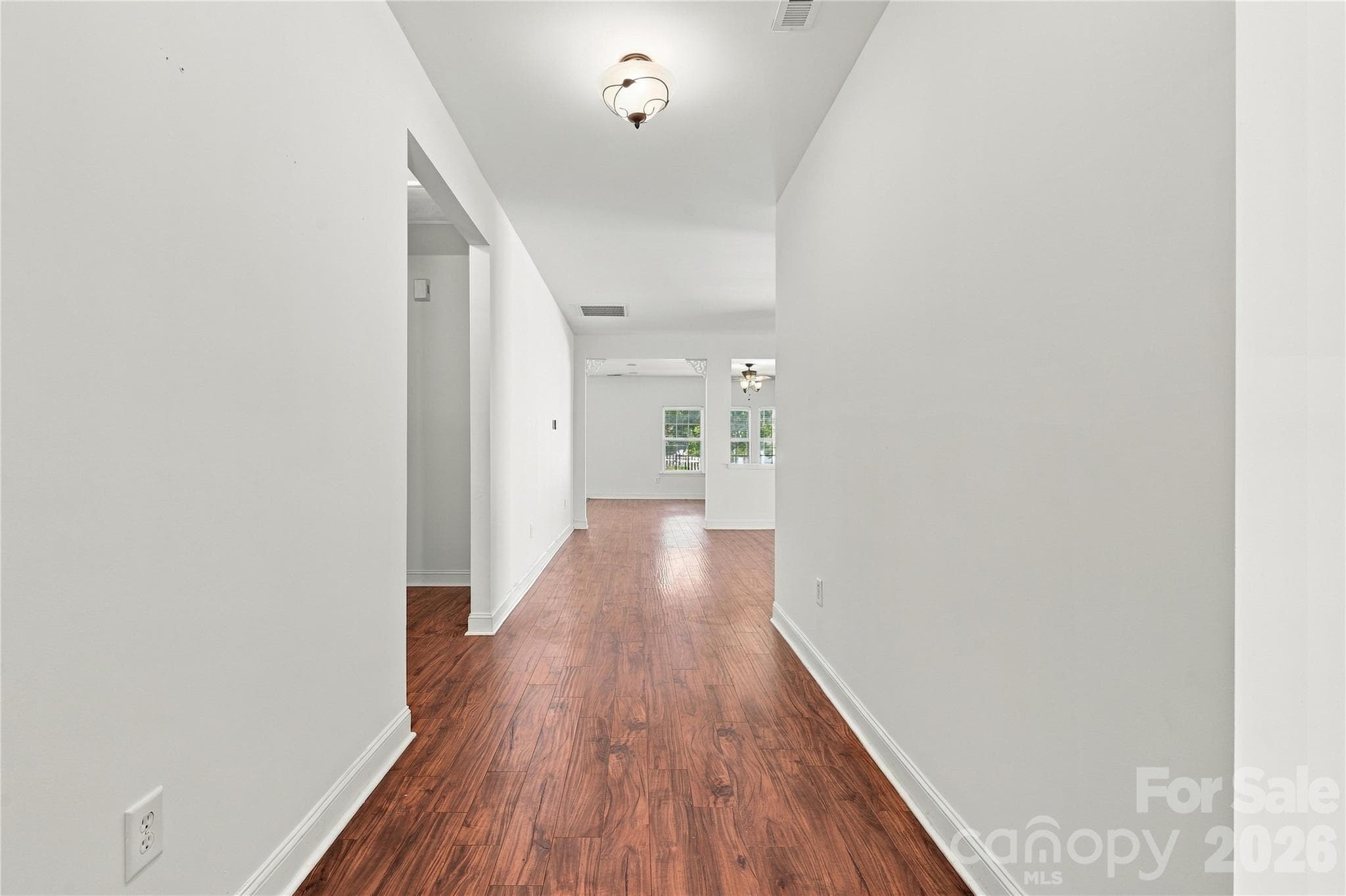 Step inside to a bright foyer with wood-look floors leading straight into the open living space. - 327 Annaberg Lane, Monroe