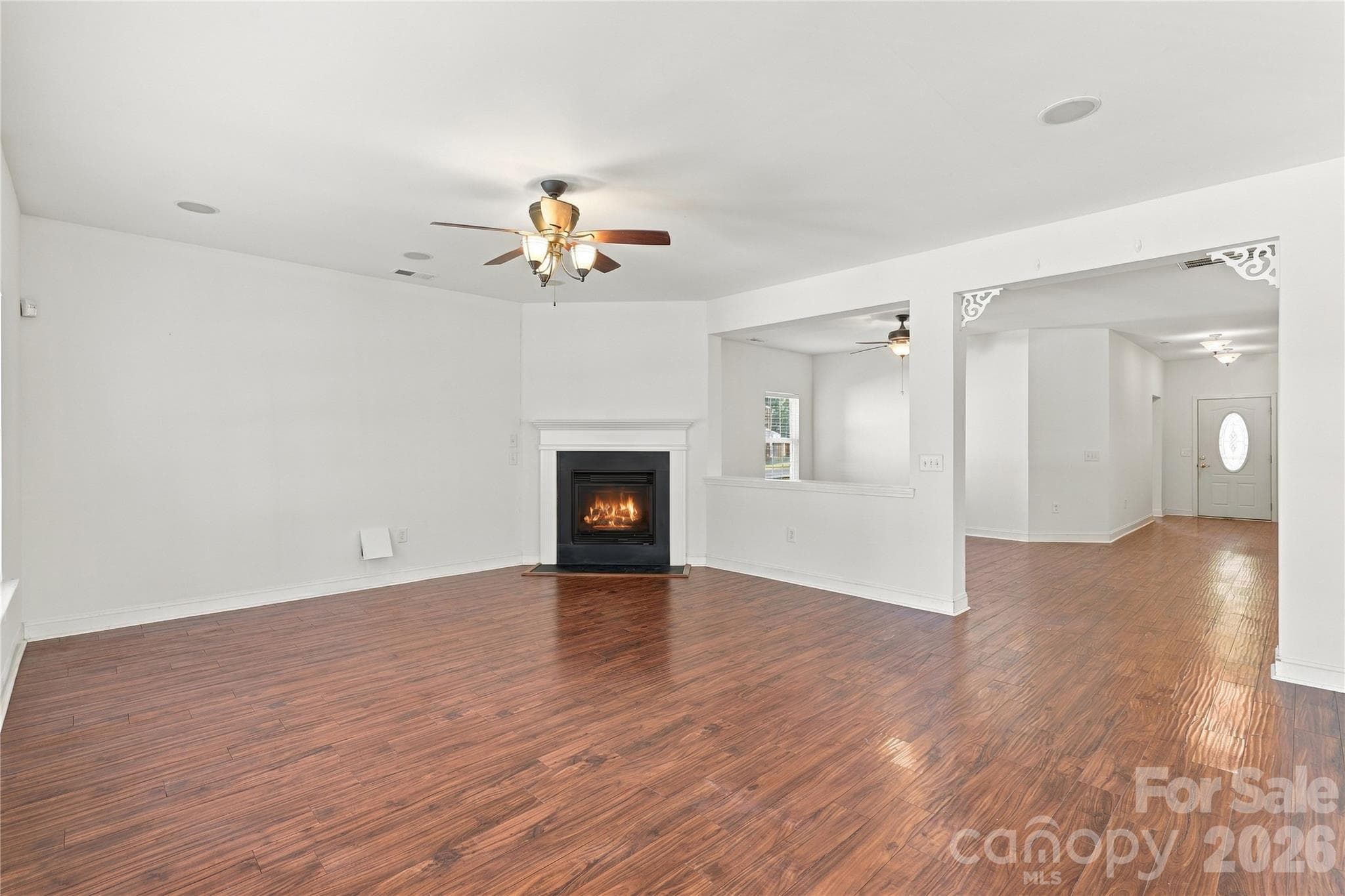 Open sight lines connect the living room to the foyer, so the home feels big and easy to move through. - 327 Annaberg Lane, Monroe