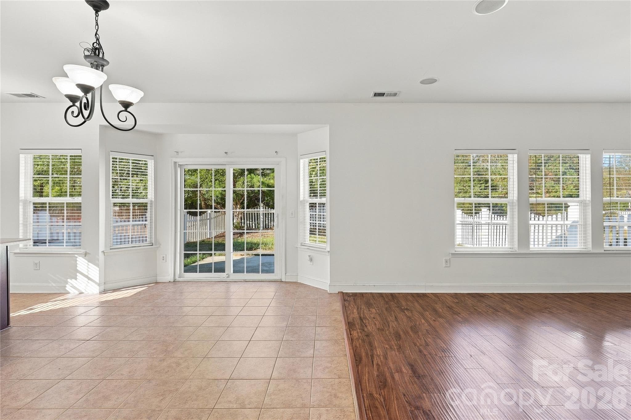 The breakfast area's bright windows and easy flow open into the main living space. - 327 Annaberg Lane, Monroe