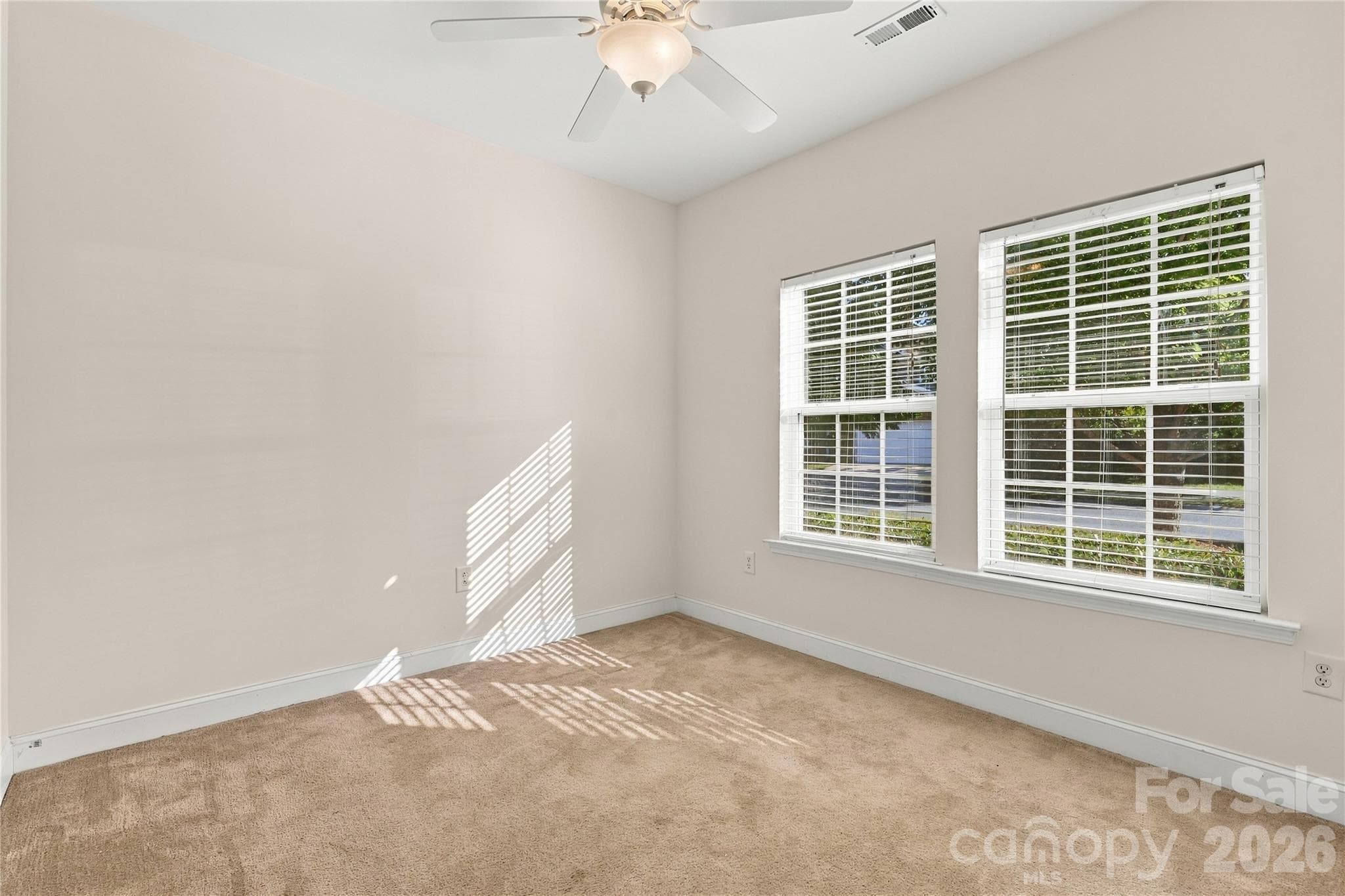 A sunny secondary bedroom with peaceful window views. - 327 Annaberg Lane, Monroe
