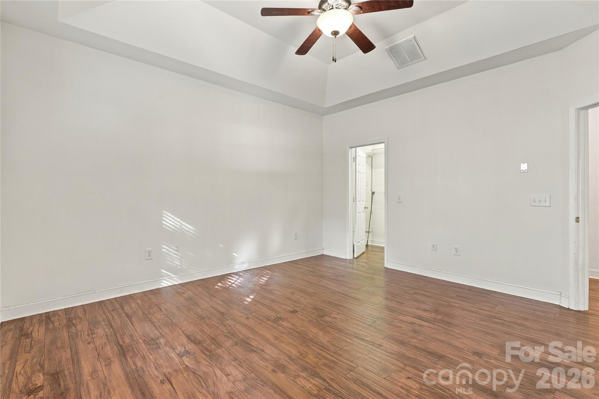 A calm, bright primary bedroom set apart from the secondary bedrooms for extra privacy. - 327 Annaberg Lane, Monroe