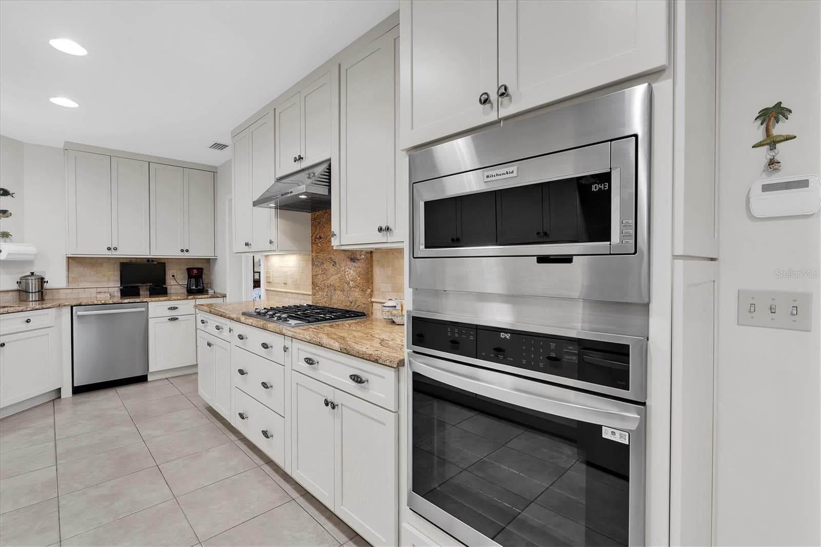 LG oven, Bosch dishwasher and KitchenAid microwave were new in May 2025 - 7106 PALM DR, HOLMES BEACH