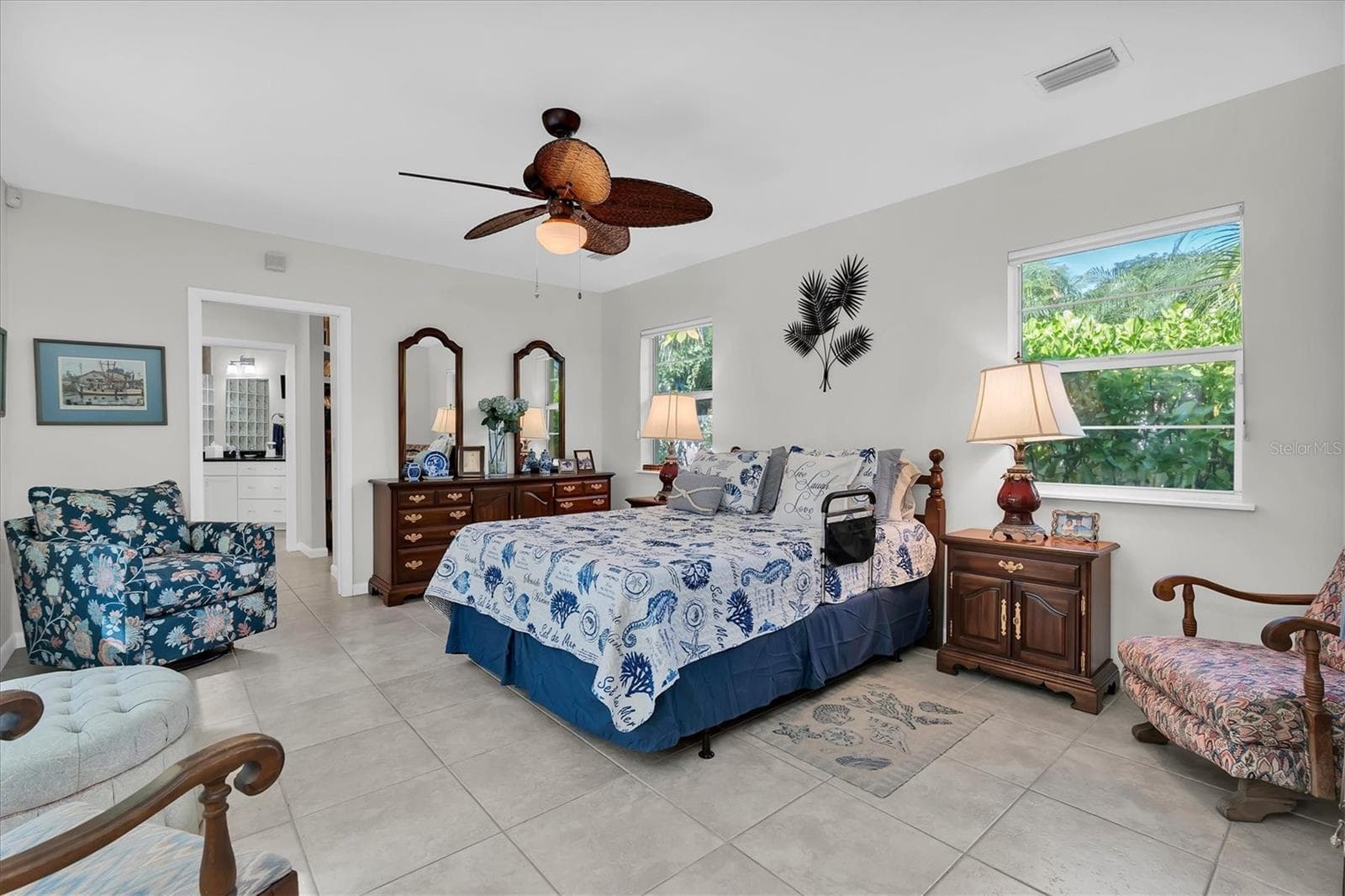 Private primary bedroom with large walk-in closet and en-suite bath has a lot of space to sit and relax. - 7106 PALM DR, HOLMES BEACH