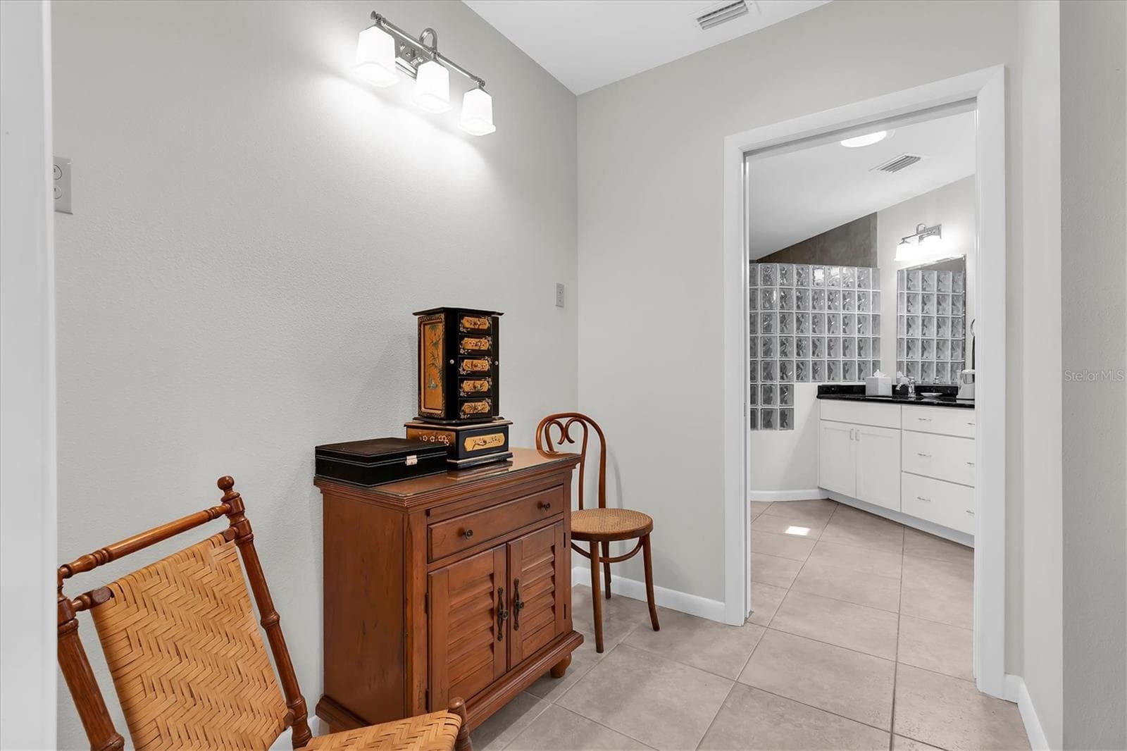 Bonus area by walk-in closet, partial view of Sola Tube skylight in the bathroom - 7106 PALM DR, HOLMES BEACH