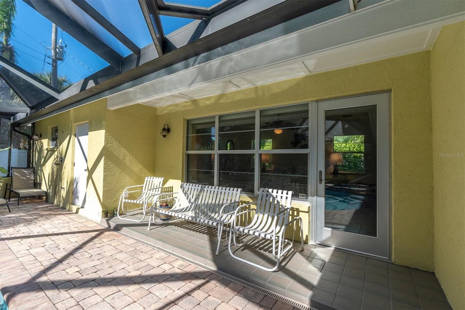 Pool bath door shown on the left. Sitting area off primary bedroom. - 7106 PALM DR, HOLMES BEACH