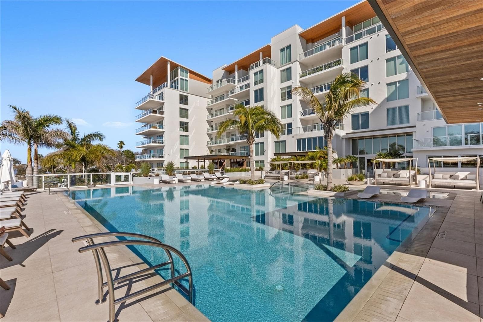 pool exterior view and lounging - 1020 SUNSET POINT RD #112, CLEARWATER