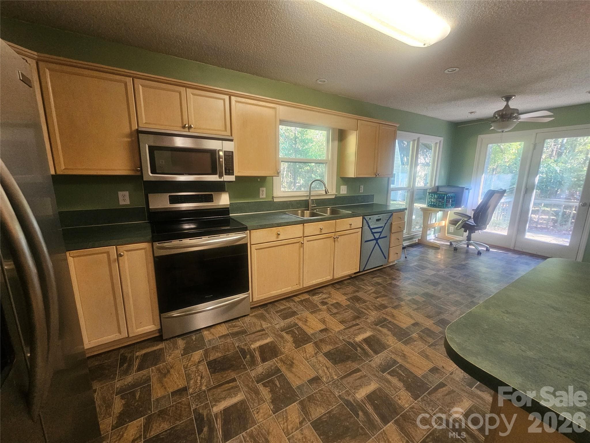 Kitchen with stainless appliances - 7313 Veranda Drive, Waxhaw