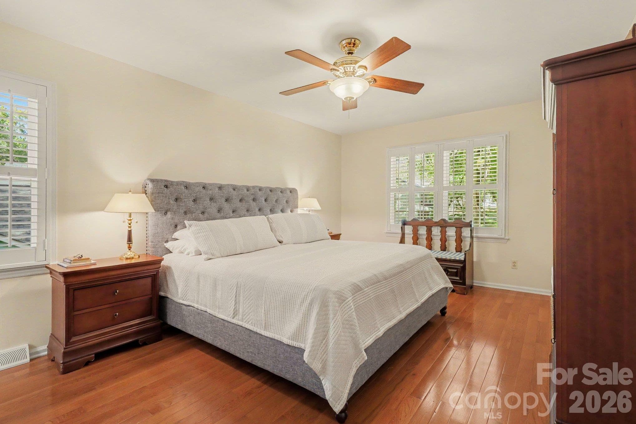 The primary bedroom is a peaceful and serene space with a walk-in closet. - 640 Heather Lane, Charlotte