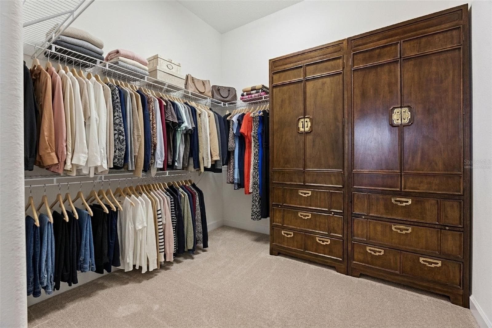 Virtually staged primary bedroom closet - 2892 SANDY CAY ST, CLERMONT