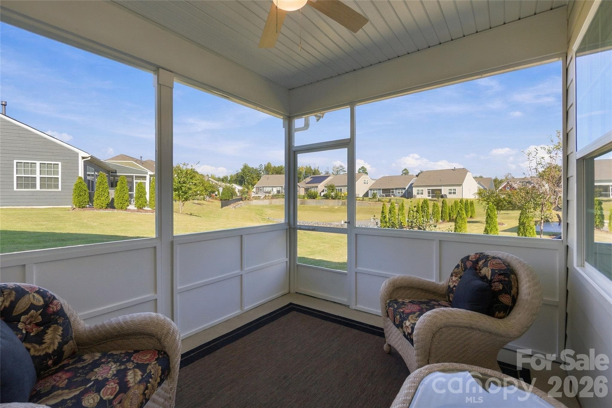 Screened Patio overlooking lush landscape with irrigation system - 3162 Windhaven Lane, Tega Cay