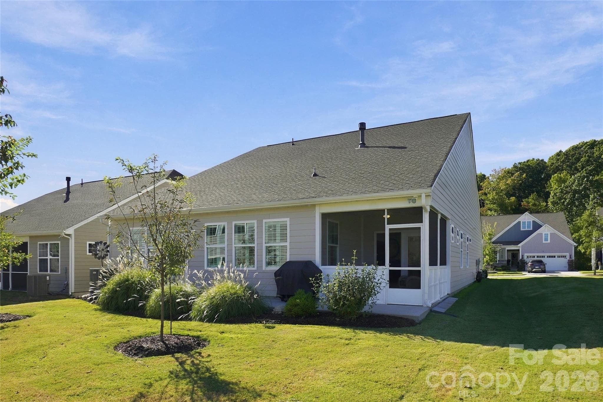 Rear of home with open community space adjacent - 3162 Windhaven Lane, Tega Cay