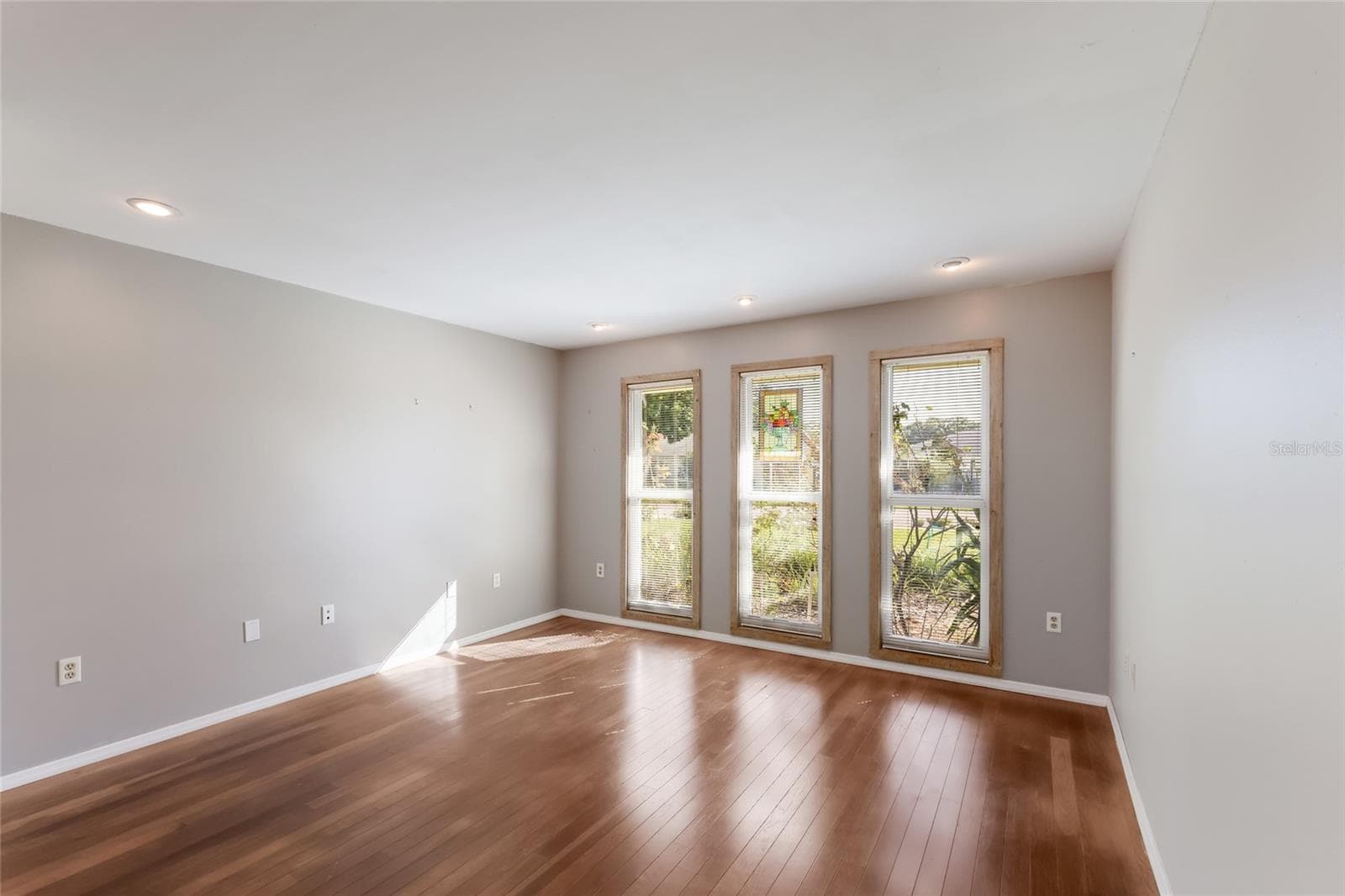 Living Room w/ impact windows - 204 46TH ST NW, BRADENTON