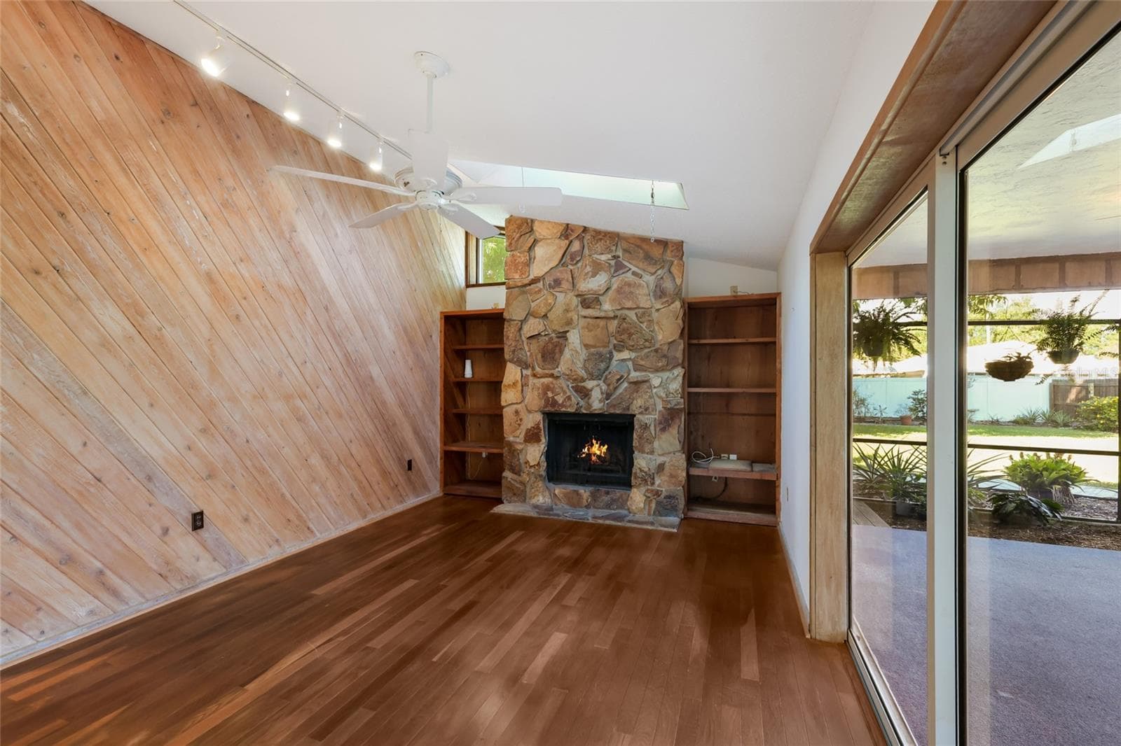 Family room w/ wood burning fireplace - 204 46TH ST NW, BRADENTON
