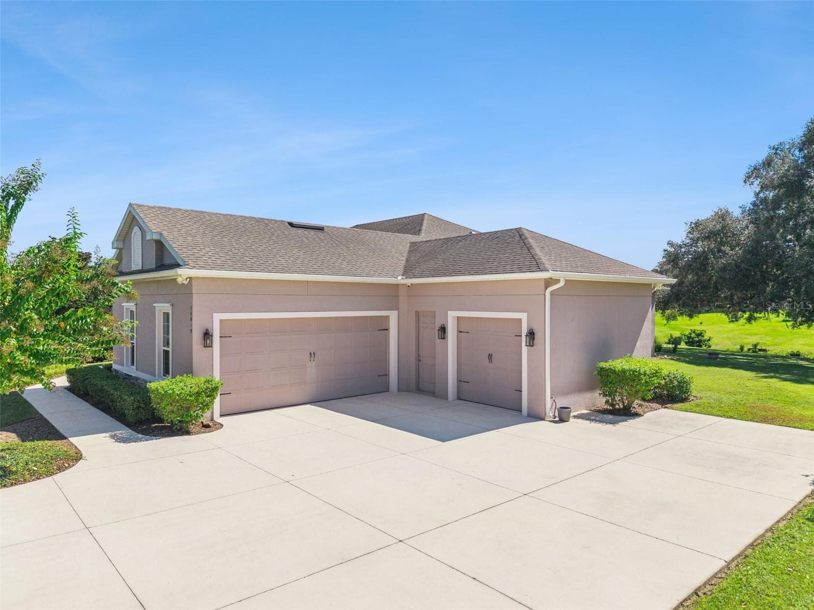 Spacious 3 car garage with storage racks and room for all your vehicles - 36819 WOLF CT, EUSTIS