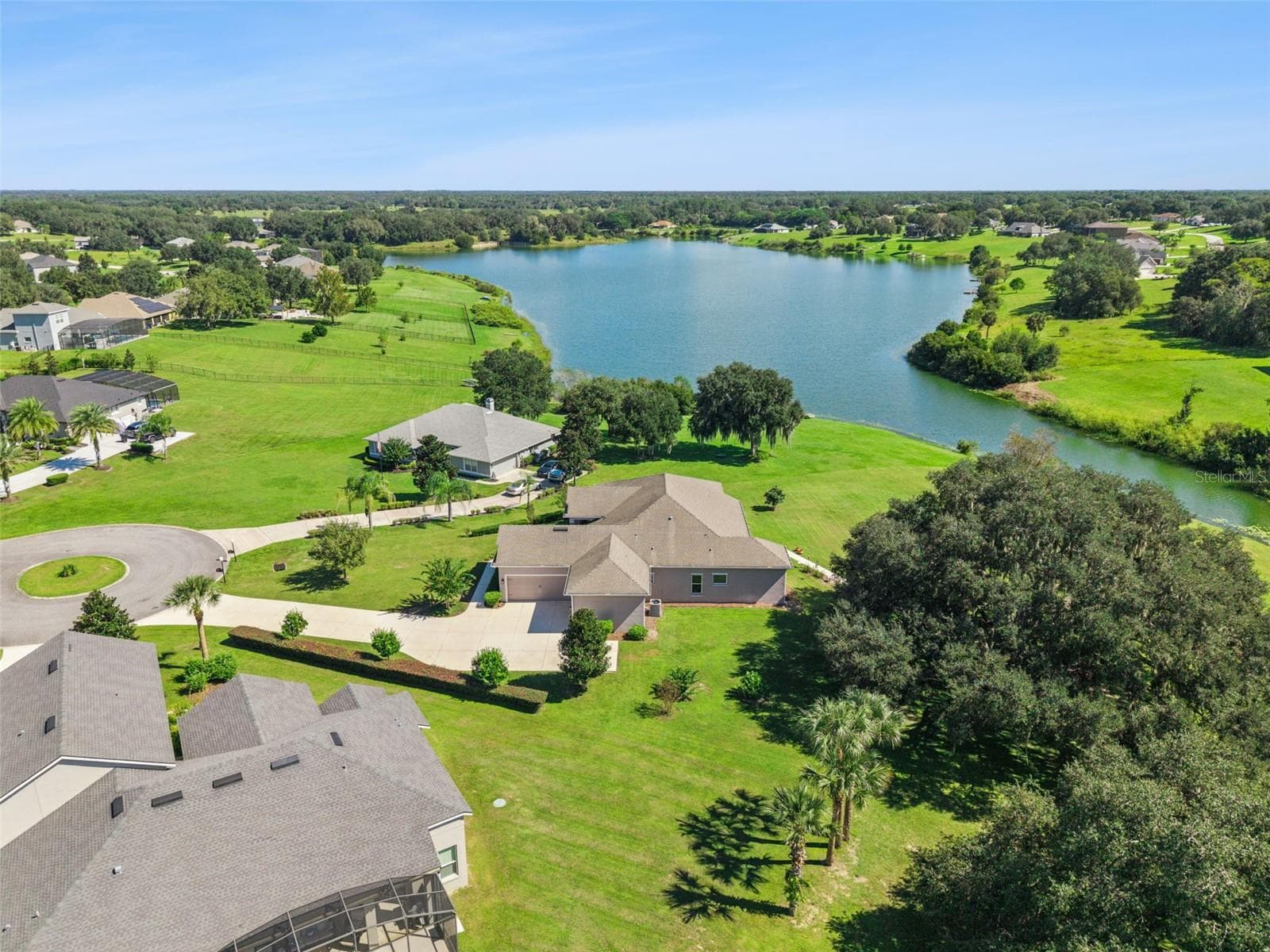 This property features a long, private driveway leading to an expansive estate. - 36819 WOLF CT, EUSTIS