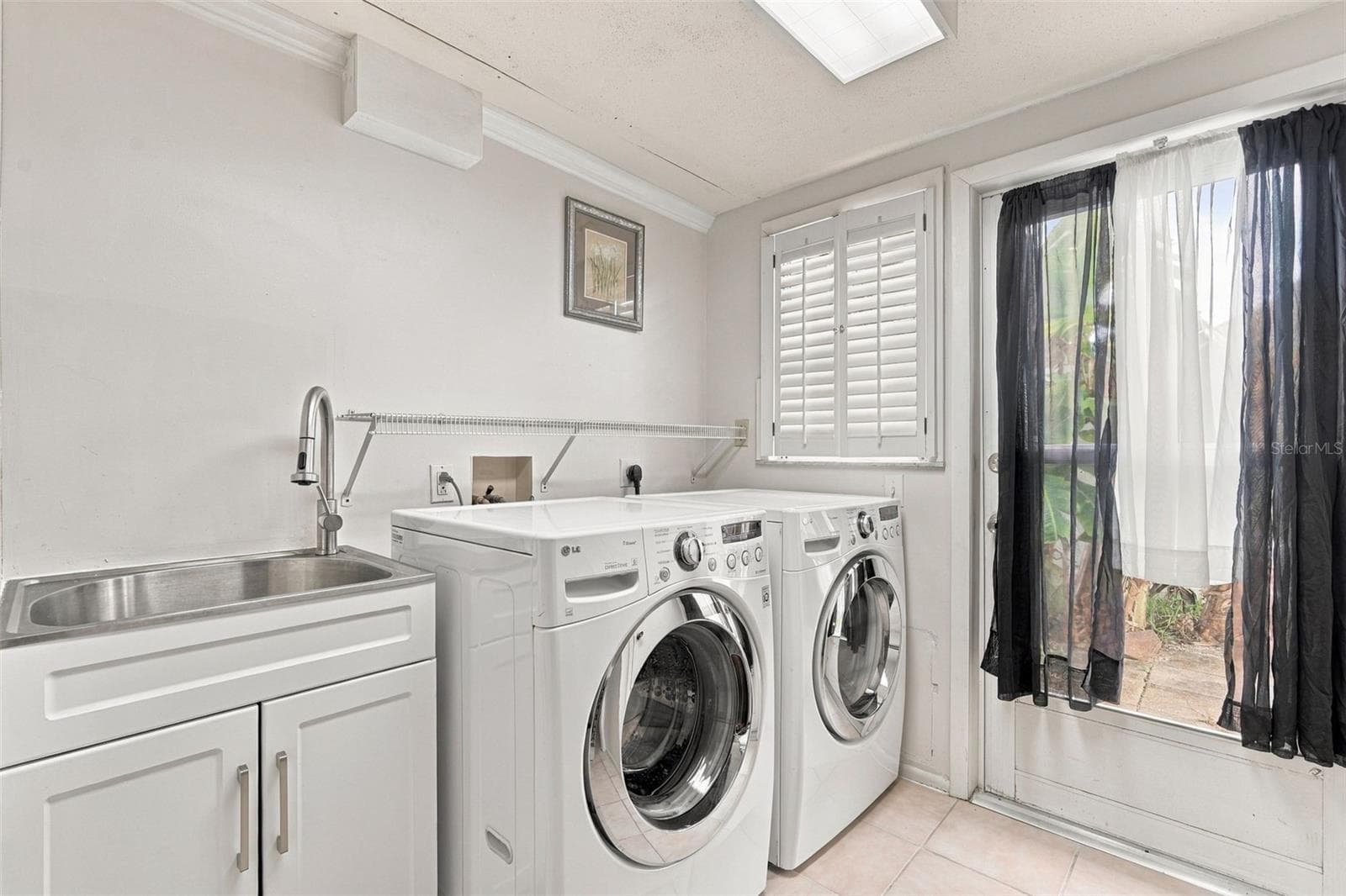 Laundry room off of Bedroom 2 - 6457 OTIS RD, NORTH PORT