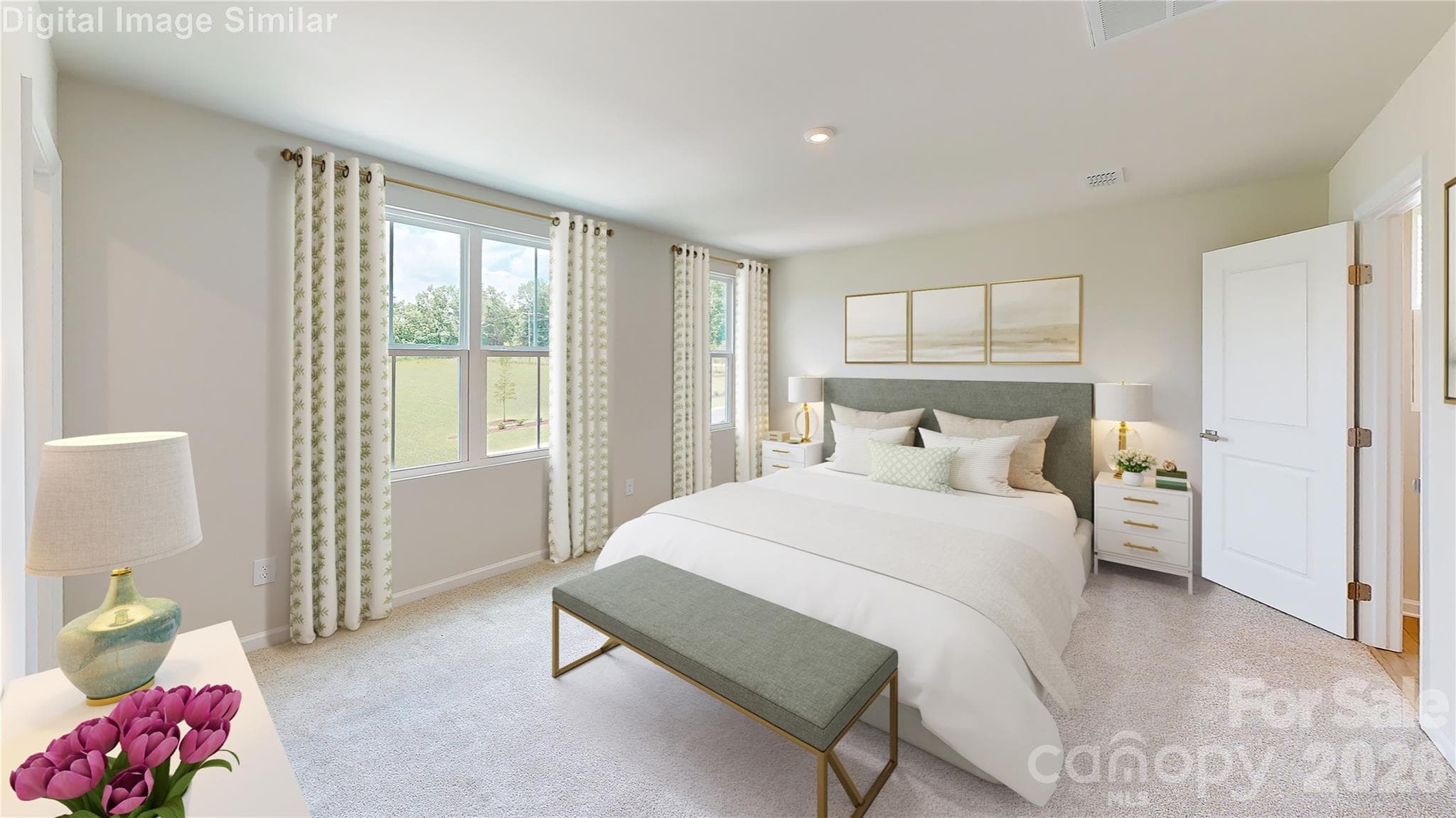 Step into the Woodford K’s luxurious primary ensuite! Plush carpet, sunlit windows, and two oversized closets offer comfort and style. It’s your personal retreat—spacious, serene, and designed to impress. The perfect escape at the end of every day. - 833 E Liberty Street, China Grove