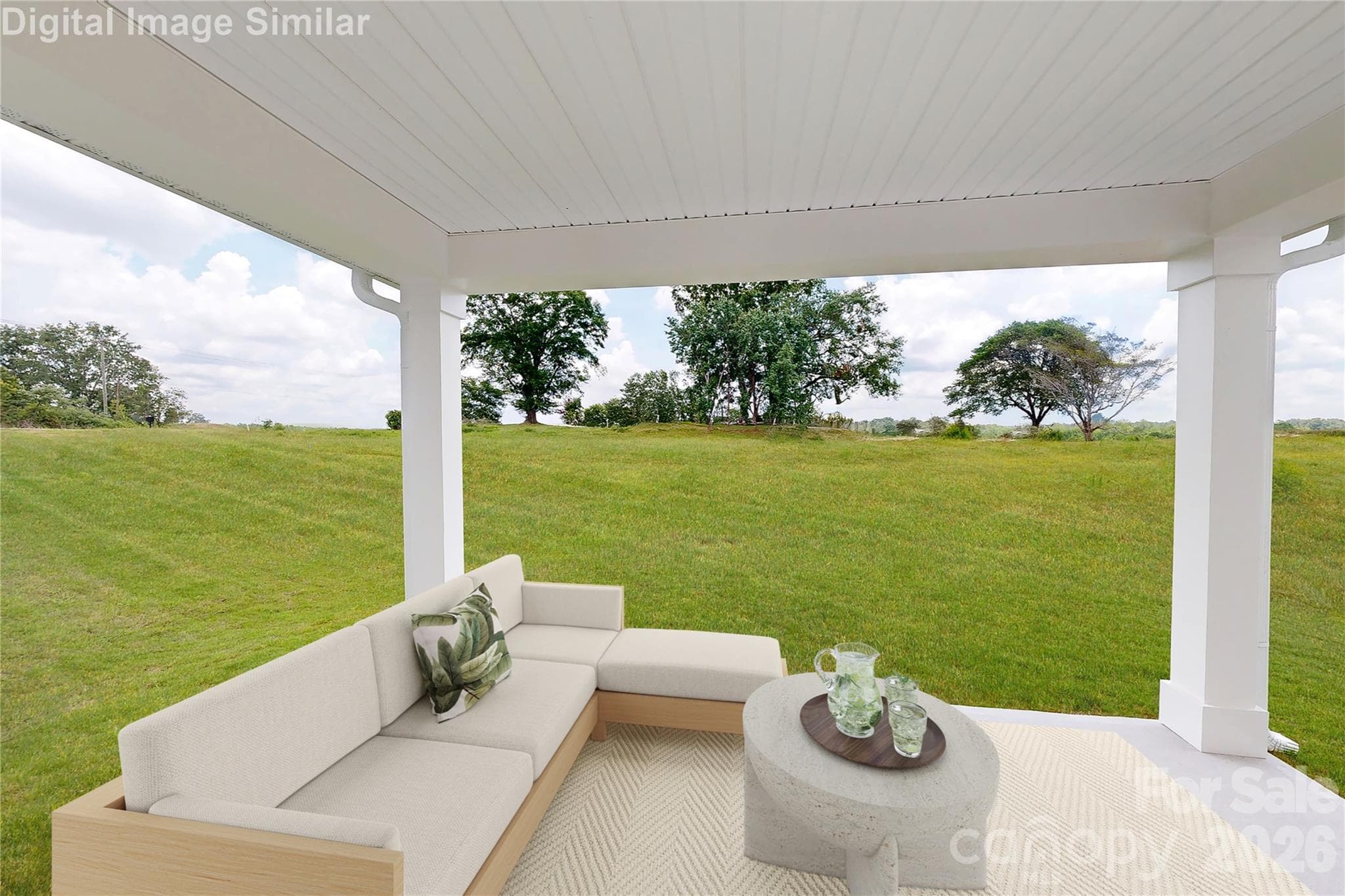 This optional covered porch is the perfect outdoor escape! Whether you're relaxing with a book, watching the kids play, or hosting casual gatherings, it offers comfort, shade, and charm. A versatile space that extends your living area and invites you to unwind. - 833 E Liberty Street, China Grove